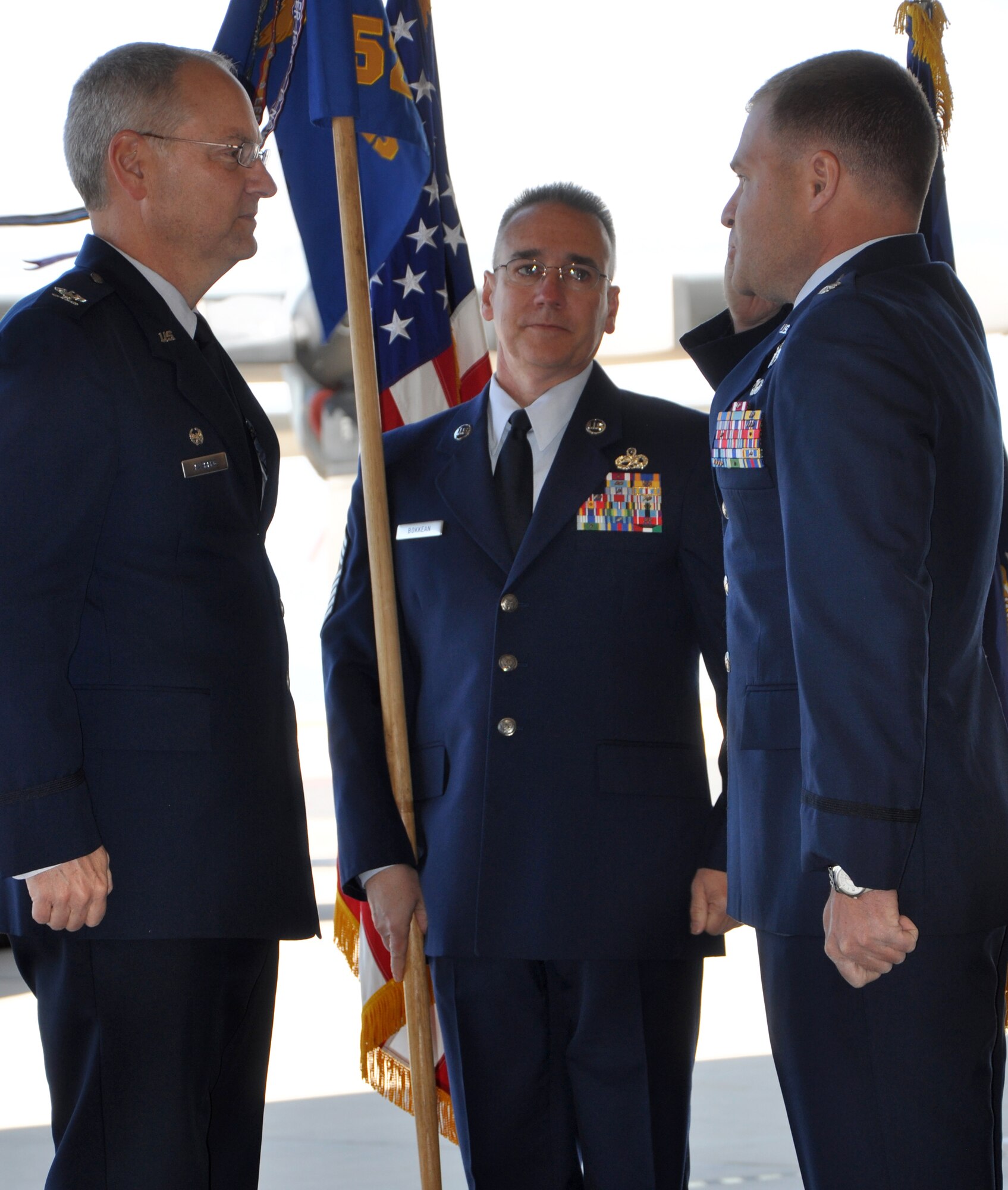 Lt. Col. Patrick Schlichenmeyer (right) salutes Col. David Kasberg, 19th Operations Group commander, before accepting command of the 52nd Airlift Squadron during that organization's change of command ceremony May 14 at Peterson Air Force Base, Colo. Colonel Schlichenmeyer took command of the squadron from outgoing commander, Lt. Col. Carlos Ortiz, in the squadron's first change of command ceremony since its reactivation in 2009. Colonel Schlichenmeyer, who previously held the position of the 52nd AS director of operations, became the leader of the squadron, known as the 'Combat Roos,' that has already logged approximately 2,000 combat hours, flown 1,800 sorties, and has transported more than 3.16 million pounds of cargo. The 52nd AS is an active associate organization partnered with the Air Force Reserve's 302nd Airlift Wing. (U.S. Air Force photo/Ann Skarban)