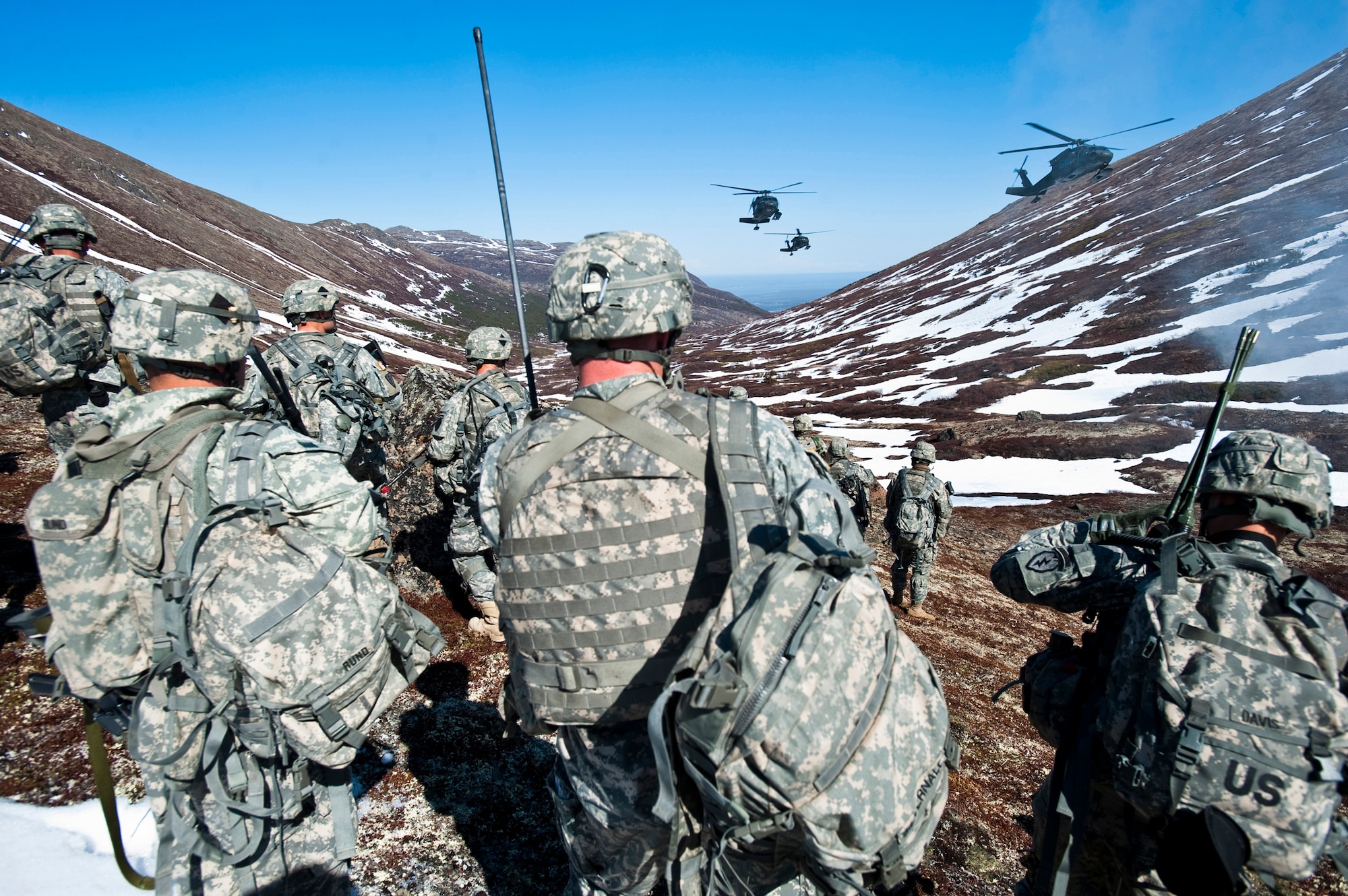JOINT BASE ELMENDORF-RICHARDSON, Alaska -- Soldiers of Comanche Company, 1st Battalion, 501st Infantry Regiment (Airborne), wait for UH-60 Black Hawk Helicopters to land in Alaska's Chugach Range May 12. The Soldiers took part in air assault training where the Black Hawks took them into a section of the mountain range and they were tasked with engaging an opposing force. (U.S. Air Force photo/Senior Airman Christopher Gross)