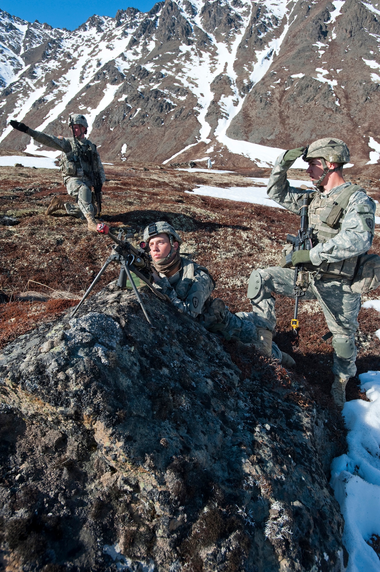 JOINT BASE ELMENDORF-RICHARDSON, Alaska -- Left to right, Sgt. Kyle Sturgill, Pvt. Trevor Freeman and Sgt. John Lamontagne all of Comanche Company, 1st Battalion, 501st Infantry Regiment (Airborne), provide security while on an air assault training missionin Alaska's Chugach Range May 12. The Soldiers took part in the air assault training where UH-60 Black Hawk helicopters took them into a section of the mountain range and they were tasked with engaging an opposing force. (U.S. Air Force photo/Senior Airman Christopher Gross)