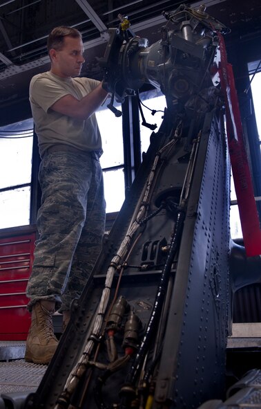 Staff Sgt. Jeffrey Marzari, 23rd Equipment Maintenance Squadron phase dock craftsman, inspects the tail of an HH-60G Pave Hawk during a 600-hour phase inspection at Moody Air Force Base, Ga., May 17. The reason for this inspection was to ensure all parts on the helicopter were in good working order. (U.S. Air Force photo/Airman 1st Class Douglas Ellis)(RELEASED)
