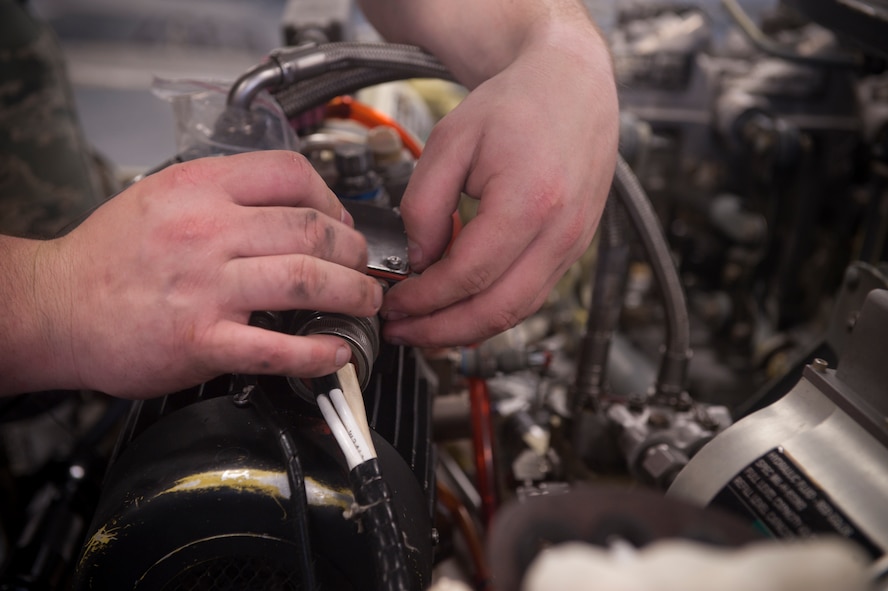 Senior Airman Aaron Swartz, 23rd Equipment Maintenance Squadron electrical environmental systems journeyman, performs a 600-hour phase inspection on an HH-60G Pave Hawk at Moody Air Force Base, Ga., May 17. This routine inspection was required after 600 flight hours to ensure the helicopter stayed mission ready. (U.S. Air Force photo/Airman 1st Class Douglas Ellis)(RELEASED)
