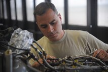 Staff Sgt. Jeffrey Mazari, 23rd Equipment Maintenance Squadron phase dock craftsman, inspects the tail of an HH-60G Pave Hawk May 17 at Moody Air Force Base, Ga. Sergeant Mazari was part of a crew from the 23rd EMS working on the HH-60 for its 600-hour flying inspection. (U.S. Air Force photo/Airman 1st Class Paul Francis)(RELEASED) 