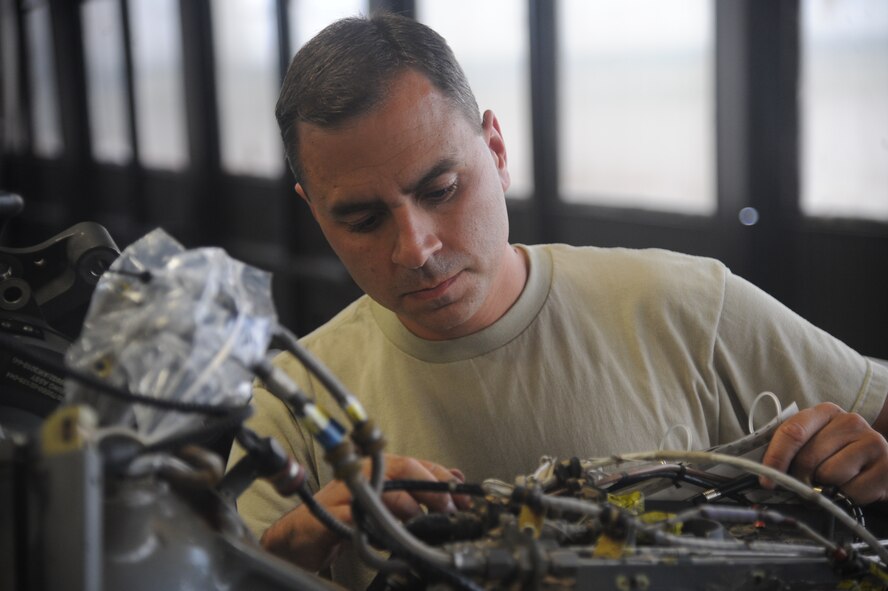 Staff Sgt. Jeffrey Mazari, 23rd Equipment Maintenance Squadron phase dock craftsman, inspects the tail of an HH-60G Pave Hawk May 17 at Moody Air Force Base, Ga. Sergeant Mazari was part of a crew from the 23rd EMS working on the HH-60 for its 600-hour flying inspection. (U.S. Air Force photo/Airman 1st Class Paul Francis)(RELEASED) 