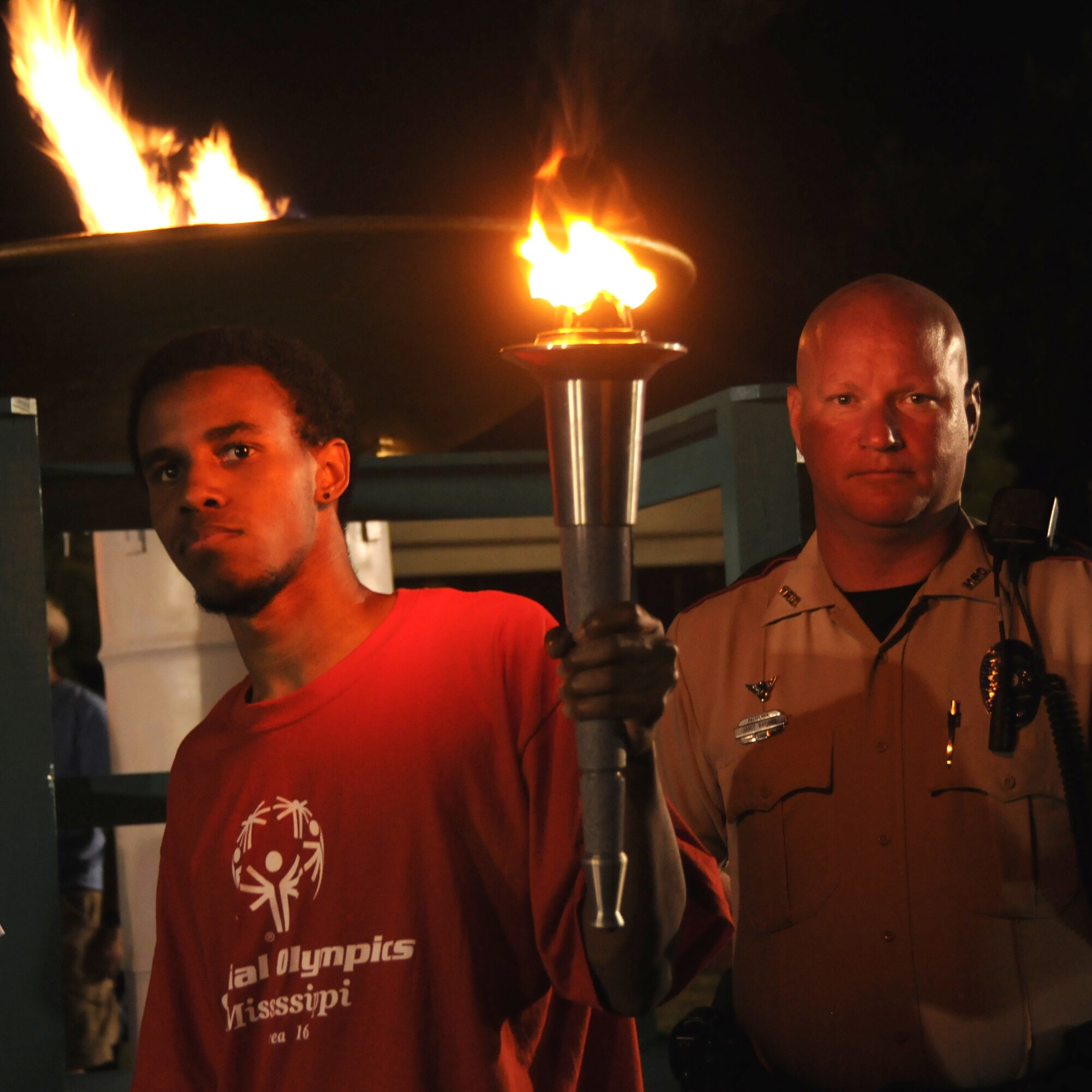 Special Olympian Deandre Brown, accompanied by Patrolman 1st Class Jamie Brooks, lit the cauldron with the “flame of hope” during Friday’s opening ceremonies for the Mississippi Special Olympics Summer Games. This year’s games were dedicated to Patrolman Brooks’ father, James “Jimmy” Brooks Sr., a longtime Special Olympics supporter. It’s the 25th year that Keesler has hosted the statewide event. Almost 1,000 athletes participated this year with their coaches and parents, bolstered by thousands of volunteers from Keesler and other organizations.  (U.S. Air Force photo by Kemberly Groue)