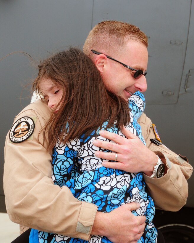 A 914th Airlift Wing Reservist receives the best welcome home any father would want.  Members from the 914th and 107th Airlift Wings were deployed in support of Operation Enduring Freedom. This is not the first time for many of these Airmen who can deploy for up to a year at a time.   (U.S. Air Force Reserve photo by Peter Borys)