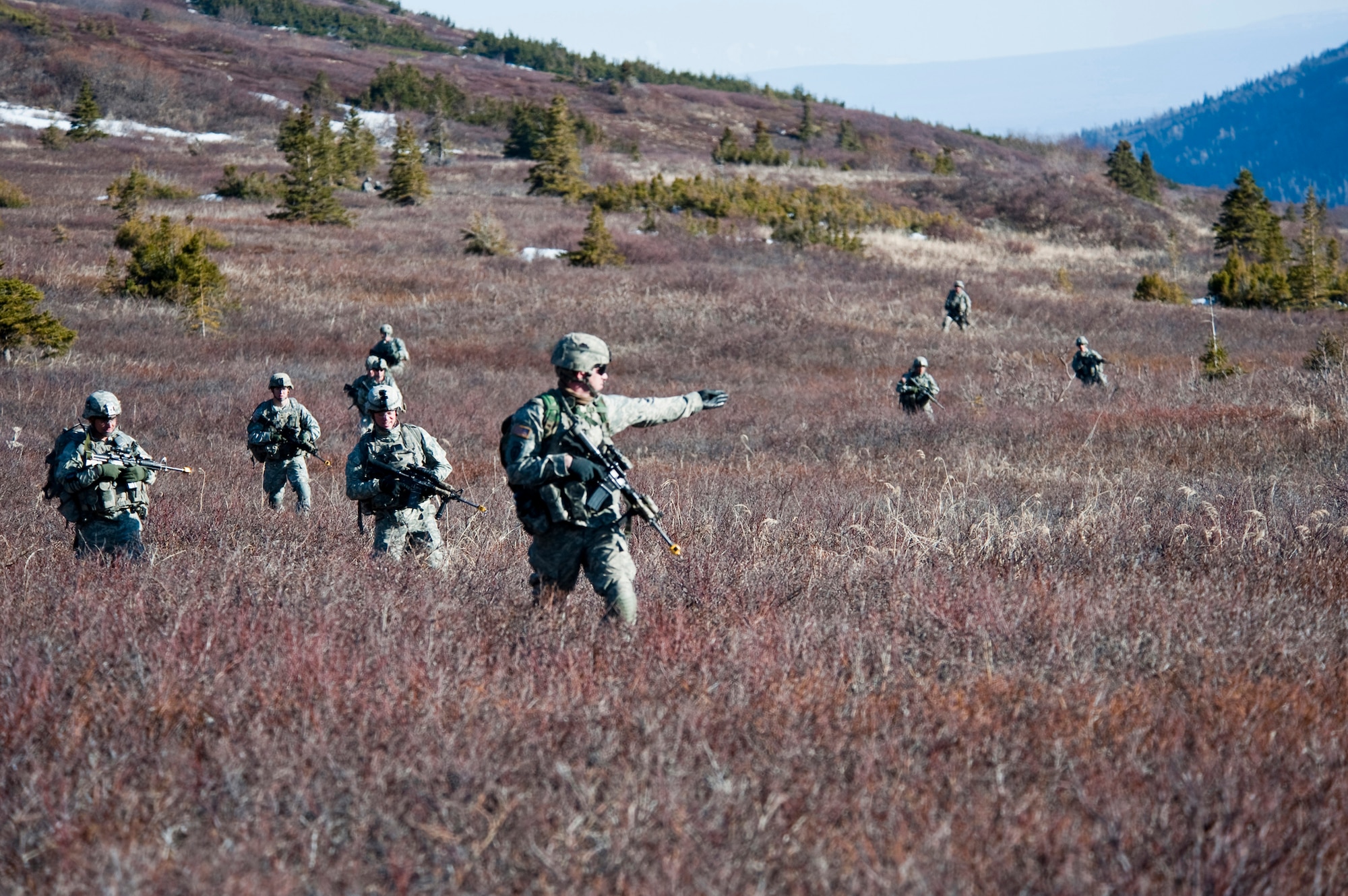 JOINT BASE ELMENDORF-RICHARDSON, Alaska -- Soldiers of Comanche Company, 1st Battalion, 501st Infantry Regiment (Airborne), make their way through Alaska's Chugach Range May 12. The Soldiers took part in air assault training where UH-60 Black Hawk helicopters took them into a section of the mountain range and they were tasked with engaging an opposing force. (U.S. Air Force photo/Senior Airman Christopher Gross)