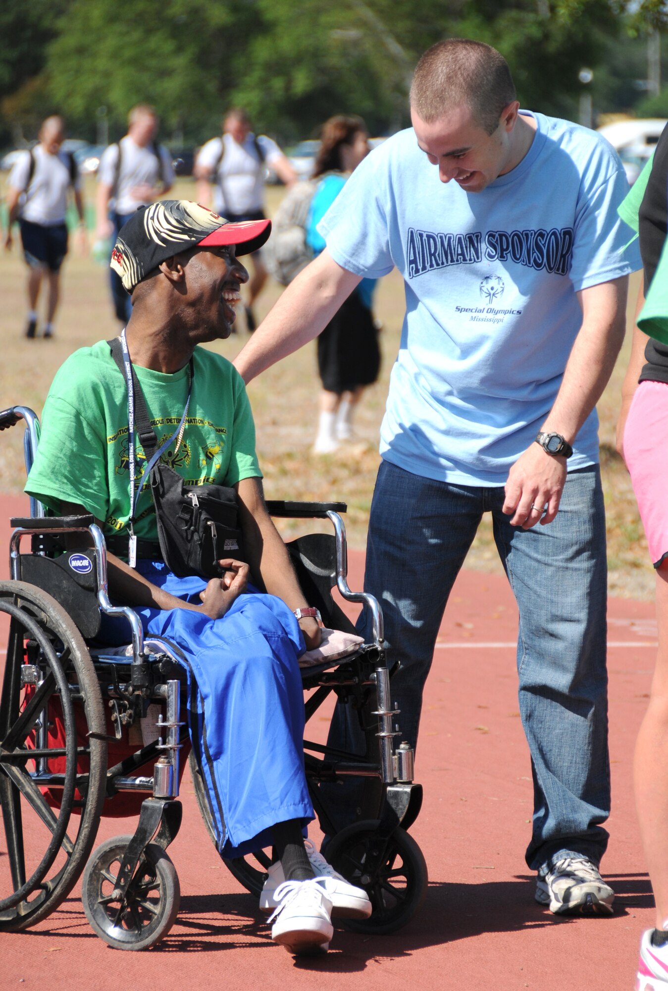 Athlete Roderick Smith and his sponsor, Airman Basic Andrew Meier, 338th
TRS student, share their excitement at the finish of the 30-meter assisted slalom
wheelchair race.  (U.S. Air Force photo by Kemberly Groue)