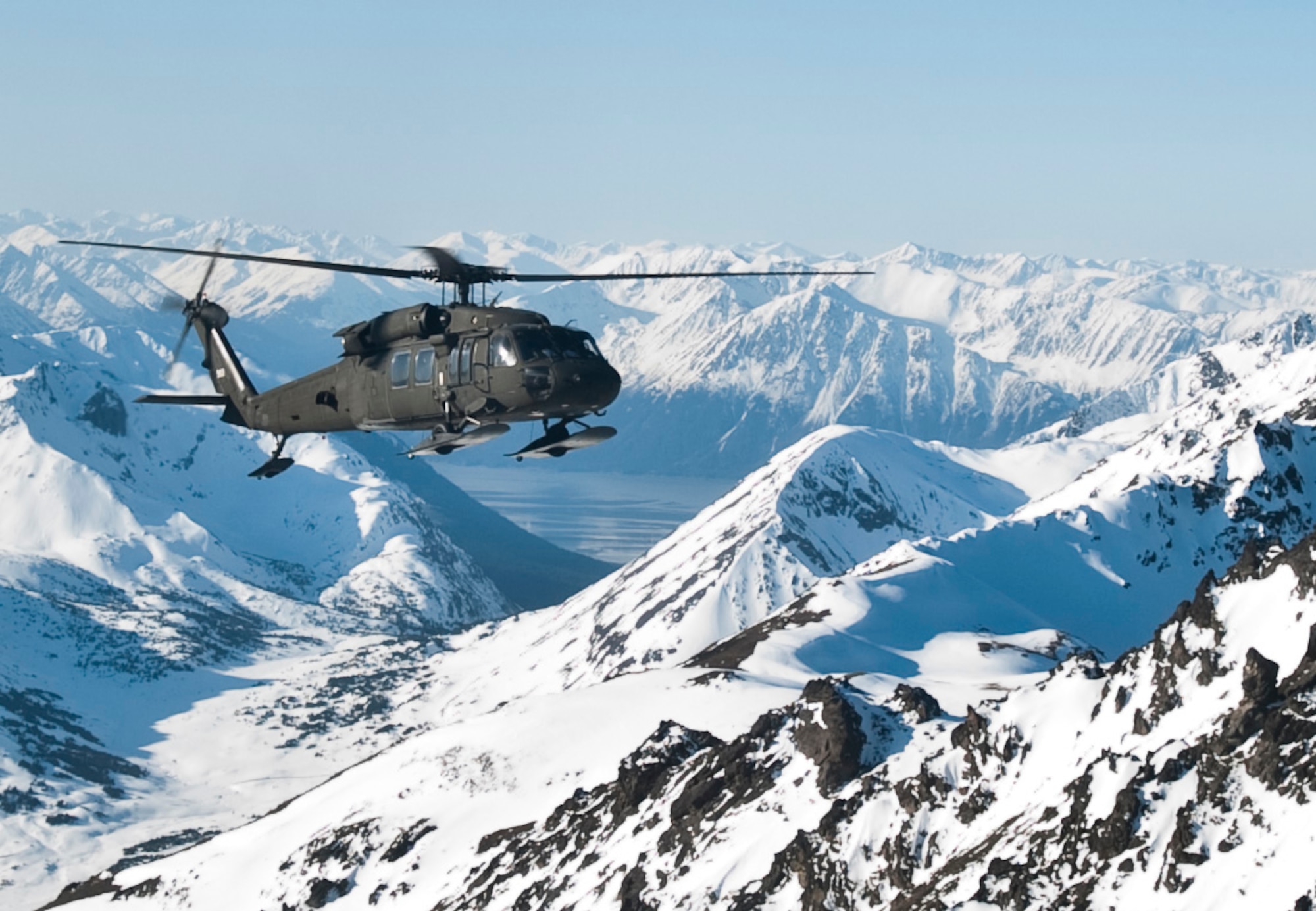 JOINT BASE ELMENDORF-RICHARDSON, Alaska -- A UH-60 Black Hawk helicopter flies over Alaska's Chugach Range May 12. Soldiers from Comanche Company, 1st Battalion, 501st Infantry Regiment (Airborne), participated in an air assault exercise, they were taken into a section of the mountain range where they engaged an opposing force. (U.S. Air Force photo/Senior Airman Christopher Gross)