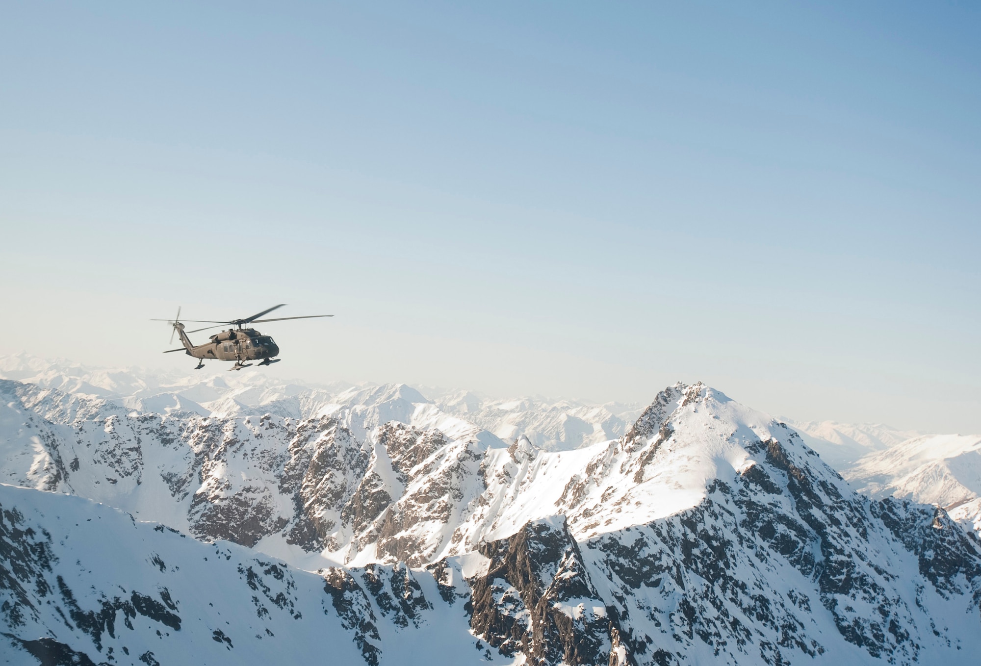 JOINT BASE ELMENDORF-RICHARDSON, Alaska -- A UH-60 Black Hawk helicopter flies over Alaska's Chugach Range May 12. Soldiers from Comanche Company, 1st Battalion, 501st Infantry Regiment (Airborne), participated in an air assault exercise, using Black Hawk helicopters, they were taken into a section of the mountain range where they engaged an opposing force. (U.S. Air Force photo/Senior Airman Christopher Gross)