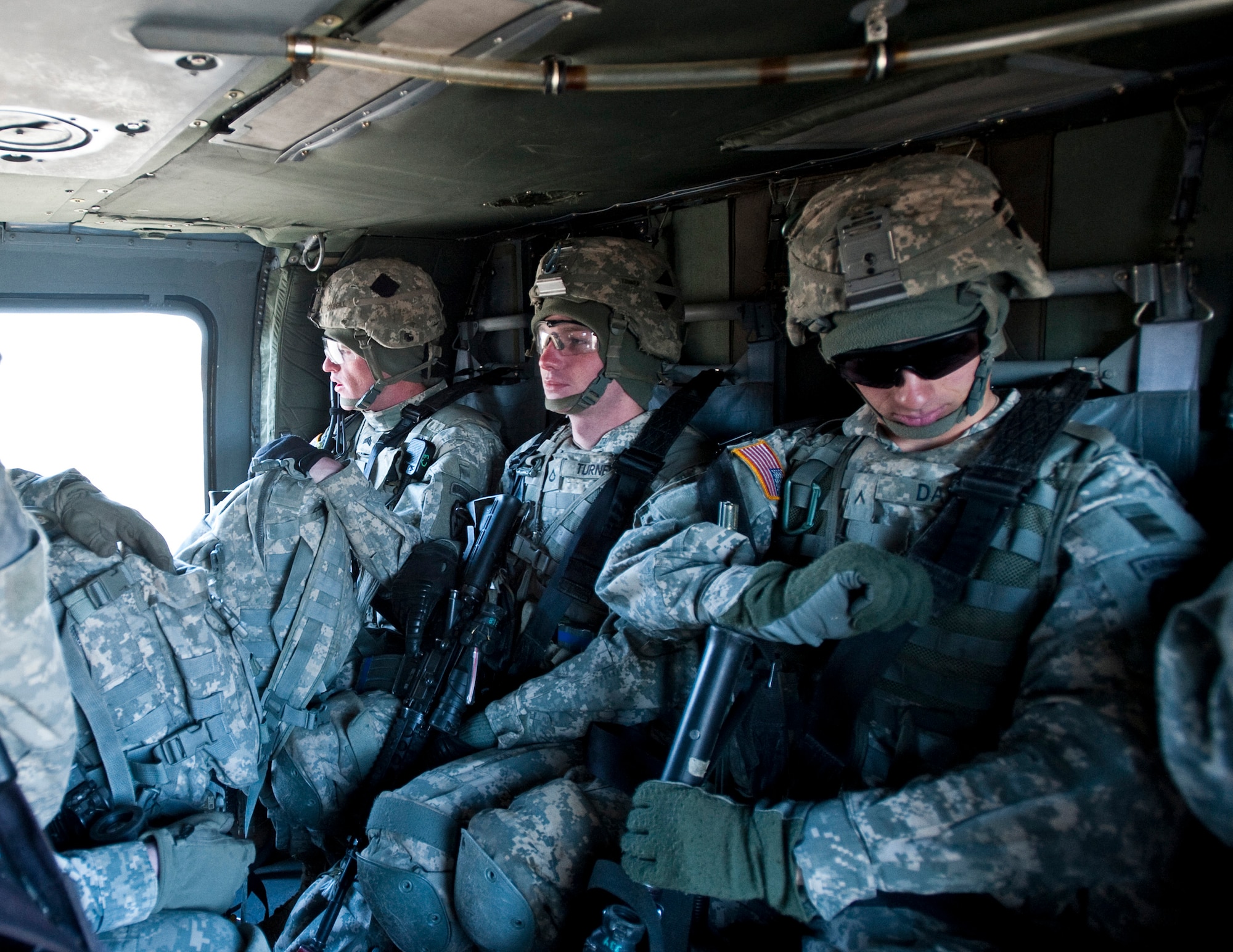 JOINT BASE ELMENDORF-RICHARDSON, Alaska -- Soldier's of 3rd Platoon, Comanche Company, 1st Battalion, 501st Infantry Regiment (Airborne), sit in a UH-60 Black Hawk helicopter May 12, as they prepare themselves for an air assault exercise where they'll be dropped into a section of Alaska's Chugach Range and tasked with engaging an opposing force. (U.S. Air Force photo/Senior Airman Christopher Gross)