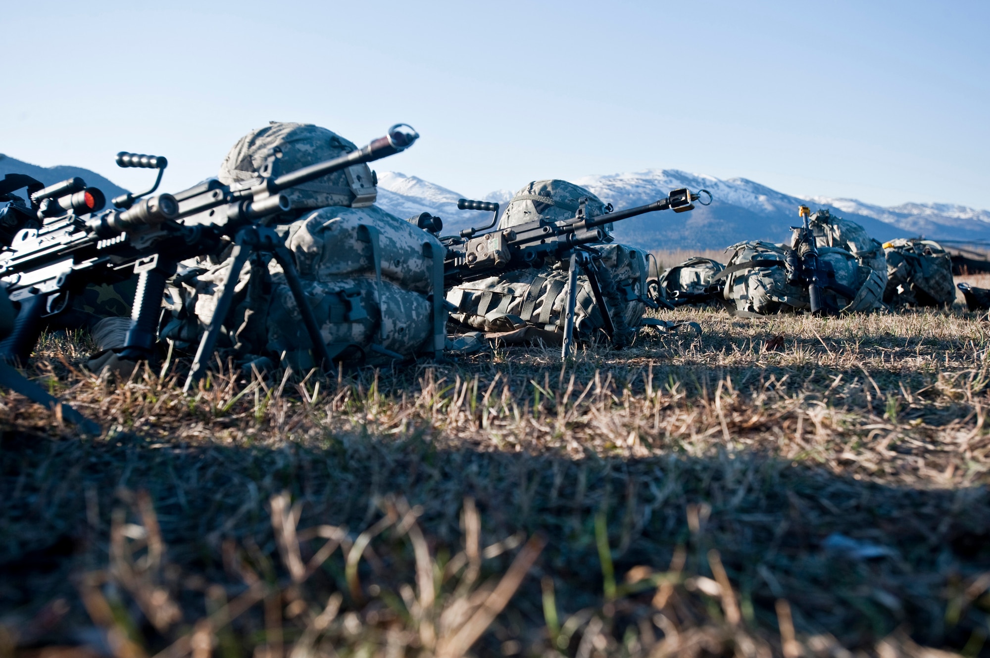 JOINT BASE ELMENDORF-RICHARDSON, Alaska -- Soldier's gear sits on the ground before an exercise May 12. Soldiers from Comanche Company, 1st Battalion, 501st Infantry Regiment (Airborne), participated in an air assault exercise, using UH-60 Black Hawk helicopters; they were taken into a section of Alaska's Chugach Range where they engaged an opposing force. (U.S. Air Force photo/Senior Airman Christopher Gross)