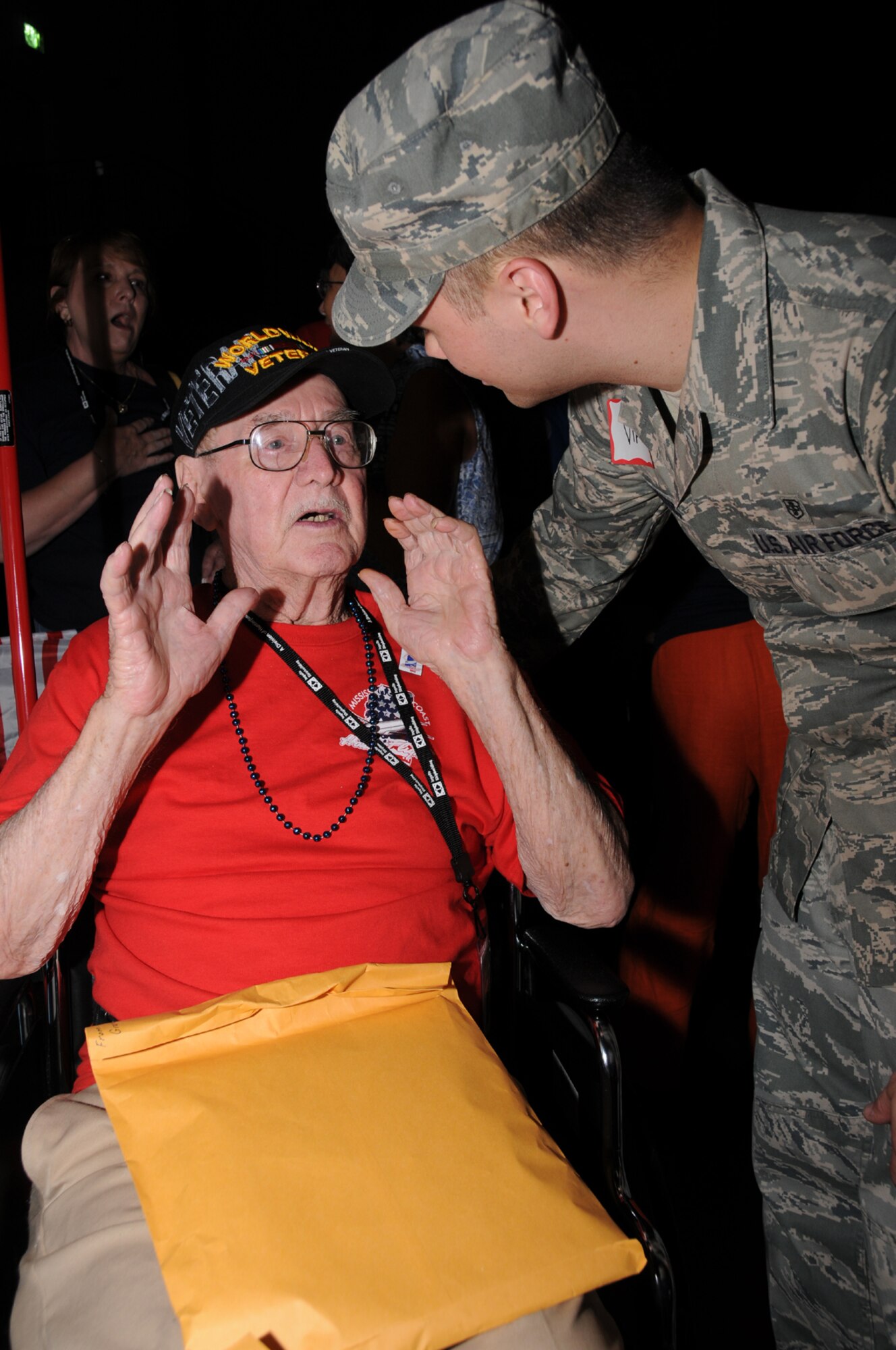 WorldWar II Navy veteranWalter Simm of Sumrall, Miss., is welcomed home by Staff Sgt. Ryan Britten, 81st Diagnostics and Therapeutics Squadron. The veterans visited theWorldWar II memorial and other sites in the nation’s capital.  (U.S. Air Force photo by Kemberly Groue)