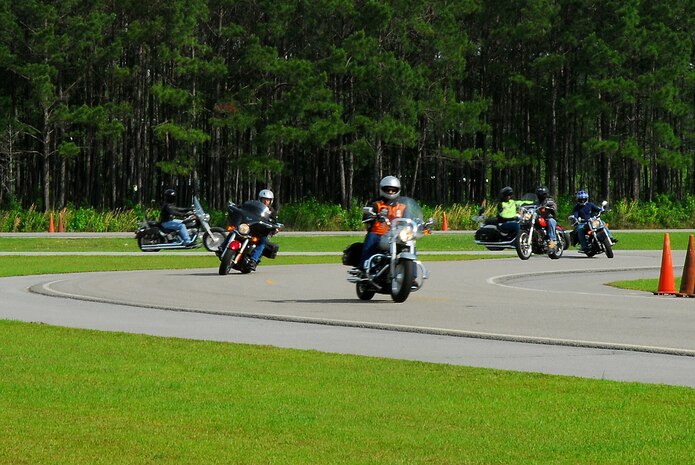 Tech Sgt. Aaron Abercrombie, 437th Aircraft Maintenance, instructs motorcyclist on safety for the practical riders’ motorcycle operation and mentorship training at Joint Base Charleston-Weapons Station, May 14.  May is the month of motorcycle safety awareness and this day of training provided riders further knowledge and experience of riding at highway speeds to ensure their continuous safety while operating a motorcycle.  (U.S. Navy photo/Machinist’s Mate 3rd Class Brannon Deugan)