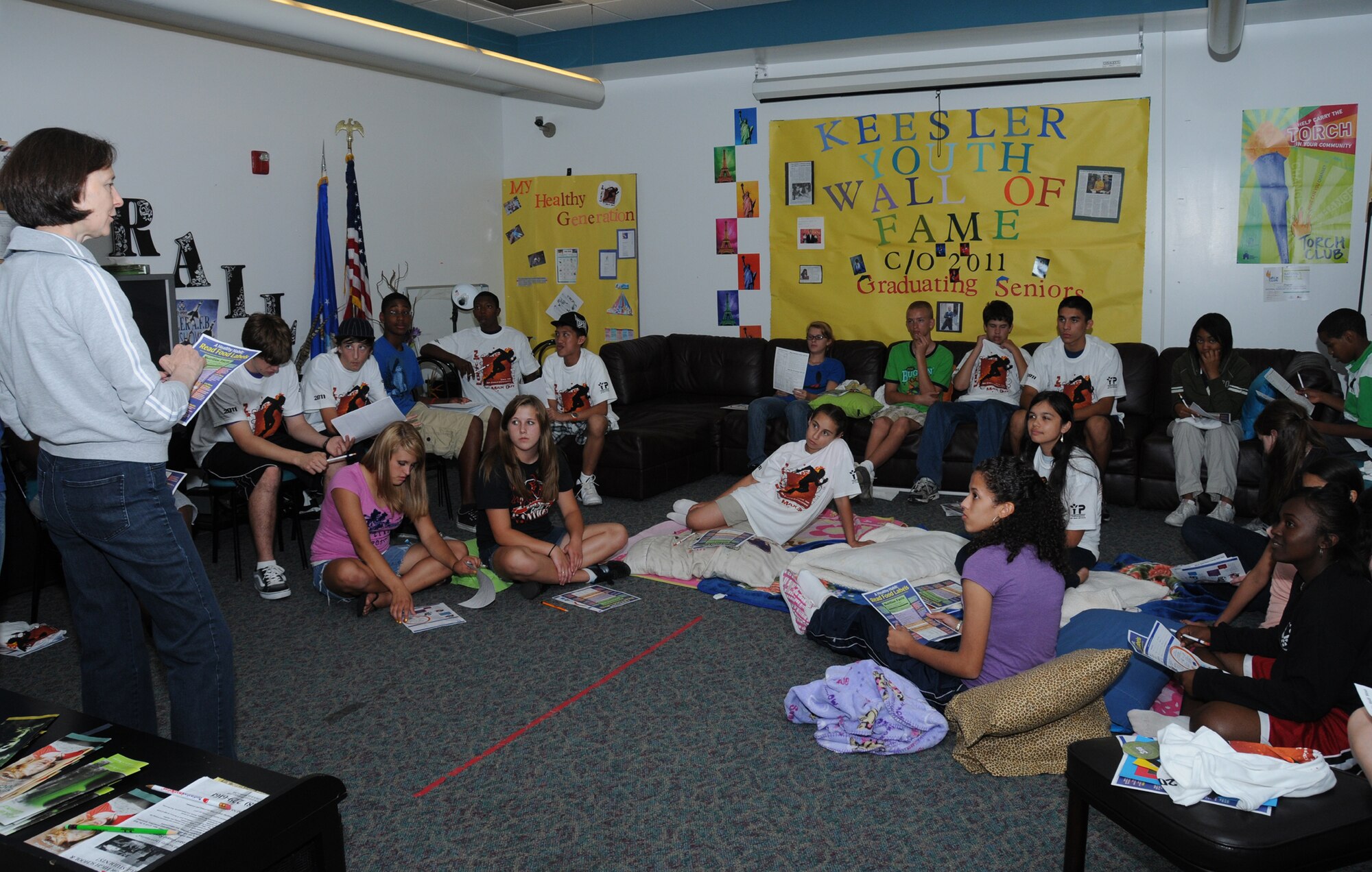 Stephanie McCann, left, a dietitian from the health and wellness center, talks to Keesler teens about nutrition at a teen lock-in May 13. The event, held in conjunction with other base youth centers around the world, also featured food, games,  challenges and other speakers.  (U.S. Air Force photo by Kemberly Groue)