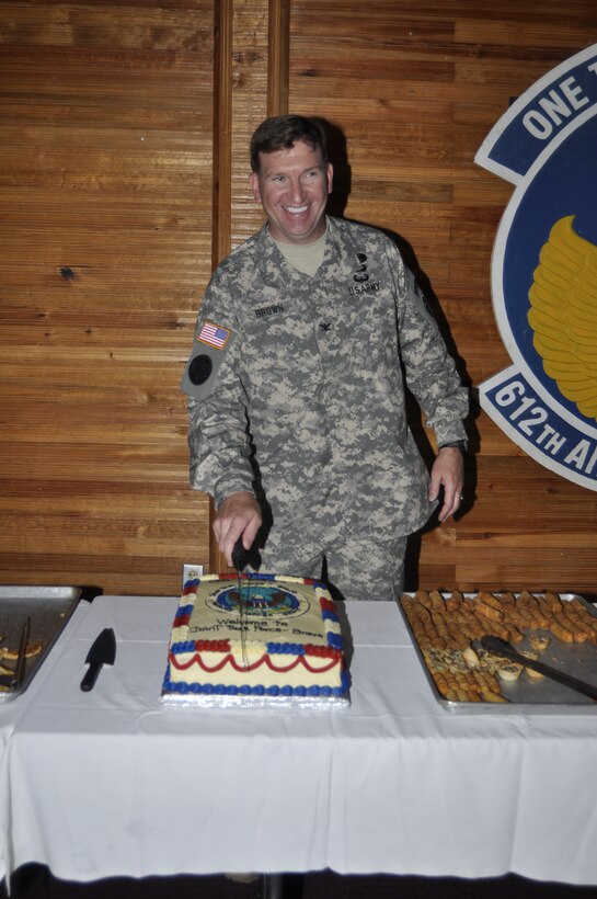 SOTO CANO AIR BASE, Honduras - Col. Ross A. Brown, Joint Task Force-Bravo commander, cuts his cake during a reception following his change of command ceremony here, May 18. (Department of Defense photo/Martin Chahin)