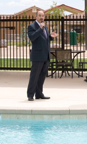 NELLIS AIR FORCE BASE, Nev.-- Robin Vaugn, Hunt Military Communities senior vice president of devolepment, speaks during the recreational pool completion ceremony.  The pool area, which is more than 4,700 square feet and can hold up to 450 people, was designed for base residents and their families and will open June 4. Construction began in 2009 with the assistance of Hunt Military Communities.  (U.S Air Force photo by Senior Airman Stephanie Rubi)