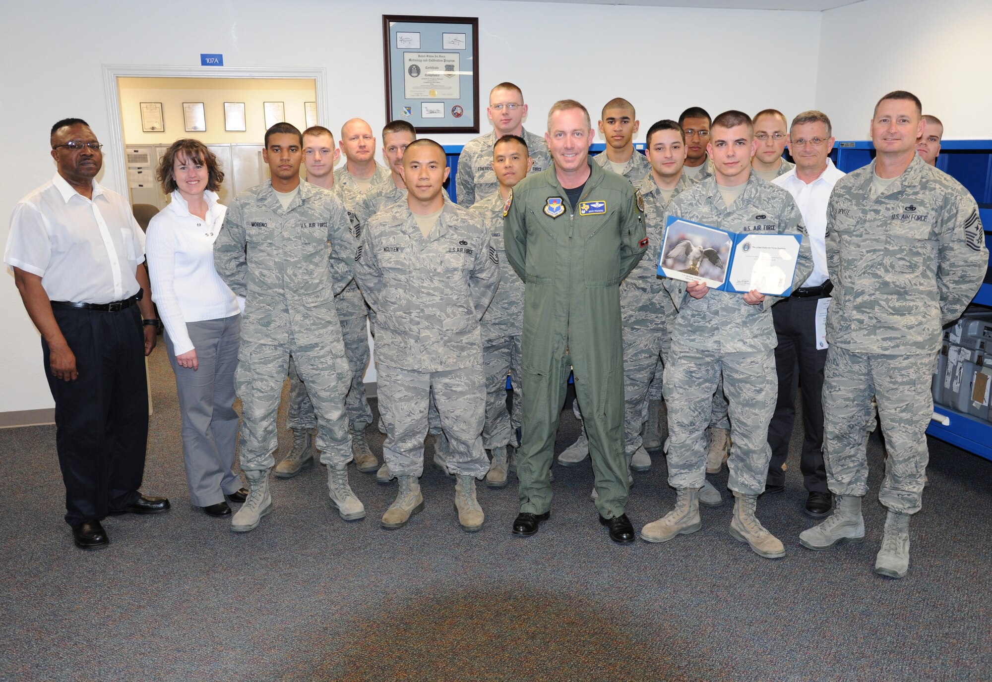LAUGHLIN AIR FORCE BASE, Texas – Airman 1st Class Daniel Mihm, 47th Maintenance Directorate, poses with Col. Michael Frankel, 47th Flying Training Wing commander, Chief Master Sgt. Ray DeVite, 47th FTW command chief, and fellow members of his squadron after being congratulated for being admitted to the Air Force Academy. Airman Mihm applied to the Academy as part of the Leaders Encouraging Airman Development program, which allows a small number of active-duty Airman to separate and attend the Academy. (U.S. Air Force photo by Airman 1st Class Blake Mize)