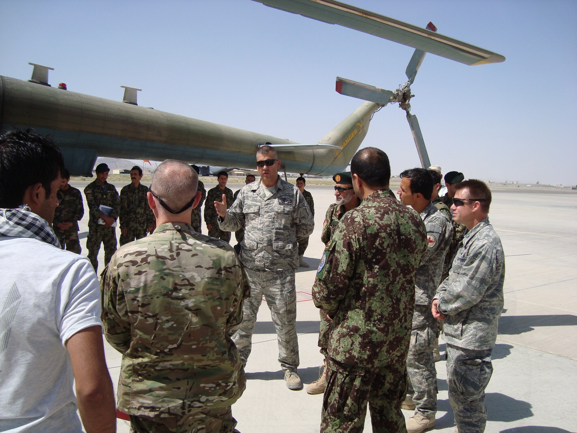 Maj. Jeffrey Hunziker makes opening remarks May 15, 2011, during a ceremony that officially opened an Afghan Mi-17 arming point at Kandahar Airfield, Afghanistan. Major Hunziker is the 442nd Air Expeditionary Advisory Squadron commander. (U.S. Air Force courtesy photo) 