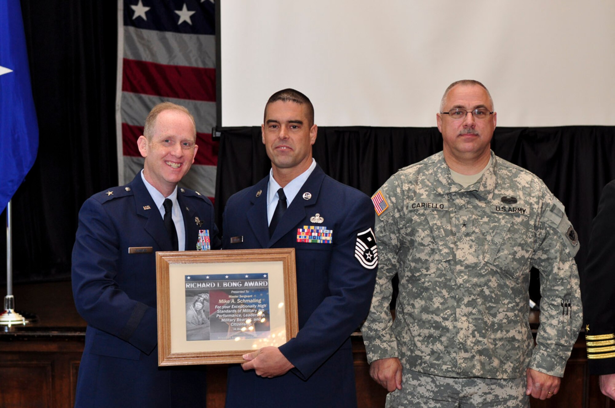 Master Sergeant Mike A. Schmaling of the 128th Air Refueling Wing receives the Bong Award during the ESGR breakfast held at the Wisconsin Club in downtown Milwaukee, May 16, 2011. Each year the Milwaukee Armed Forces Committee and Wisconsin Committee for Employer Support of the Guard and Reserve (ESGR) recognize the men and women who serve the armed forces and the employers that support them. U.S. Air Force photo by Tech Sgt. Thomas J Sobczyk / Released