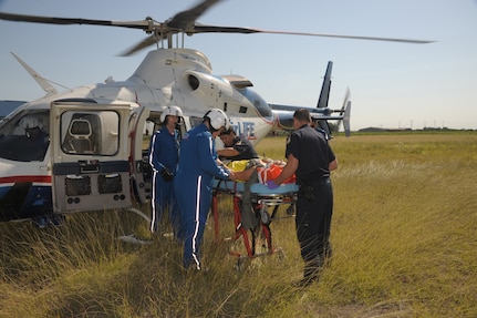 San Antonio AirLife  and Seguin fire department personnel prepare to place Staff Sgt Jennifer Swain, 359th Dental Squadron into the AirLife Helicopter May 17, during a practice exercise  in Seguin, Texas.  Exercises take place often to keep military as well as nearby community personnel, trained and prepared for any emergency. (U.S. Air Force photo/Joel Martinez) (released)