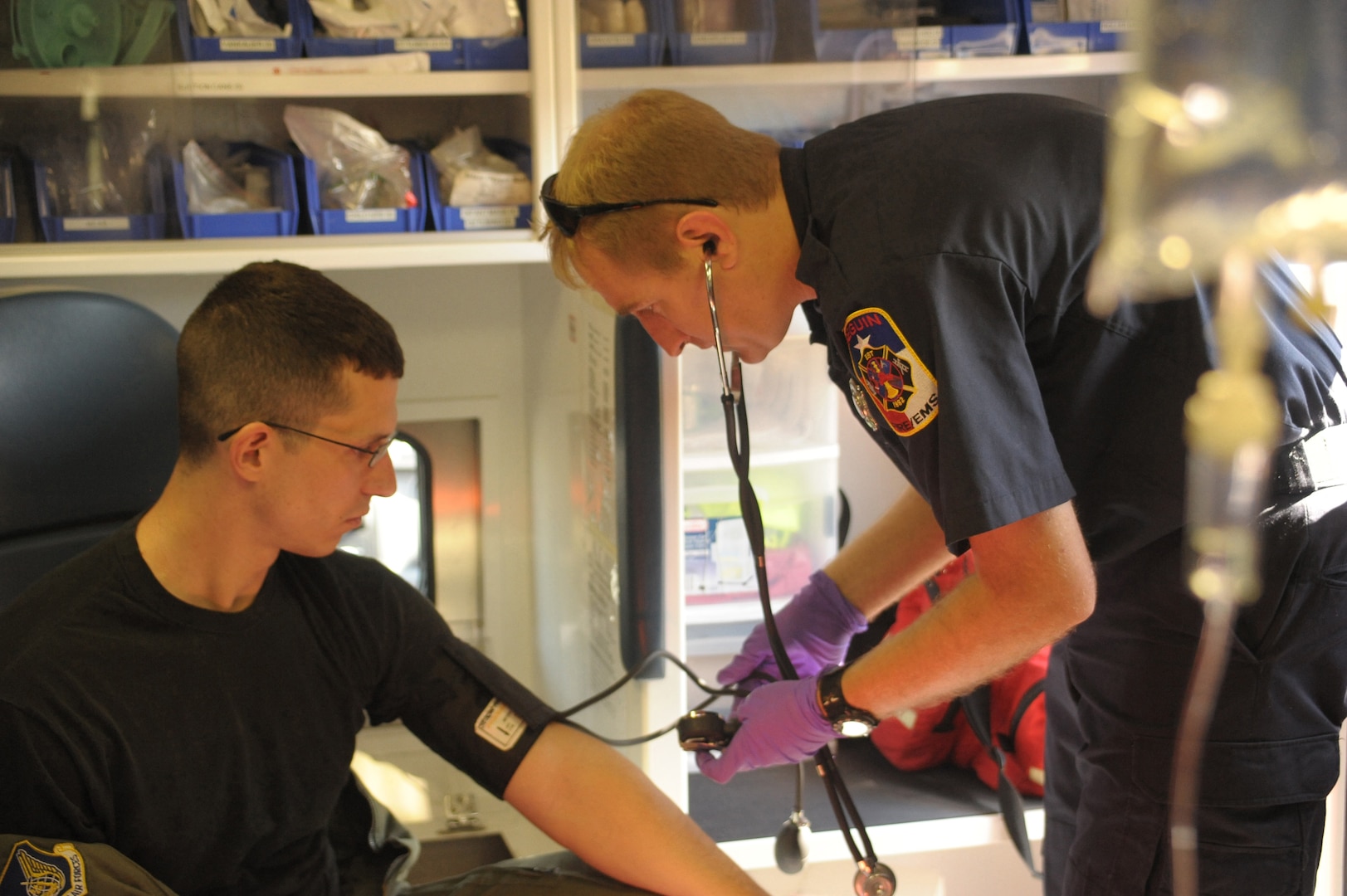 2nd Lt Travis Chase, 12th Operations Support Squadron,  is treated by Seguin Fire department paramedic James Talbots, during an exercise May 17.  The exercise, which involved response forces from Seguin, Texas, and Randoph Air Force Base, allowed an opportunity to train and prepare military and community peersonnel for real world emergencies.  (U.S. Air Force photo/Joel Martinez) (released)