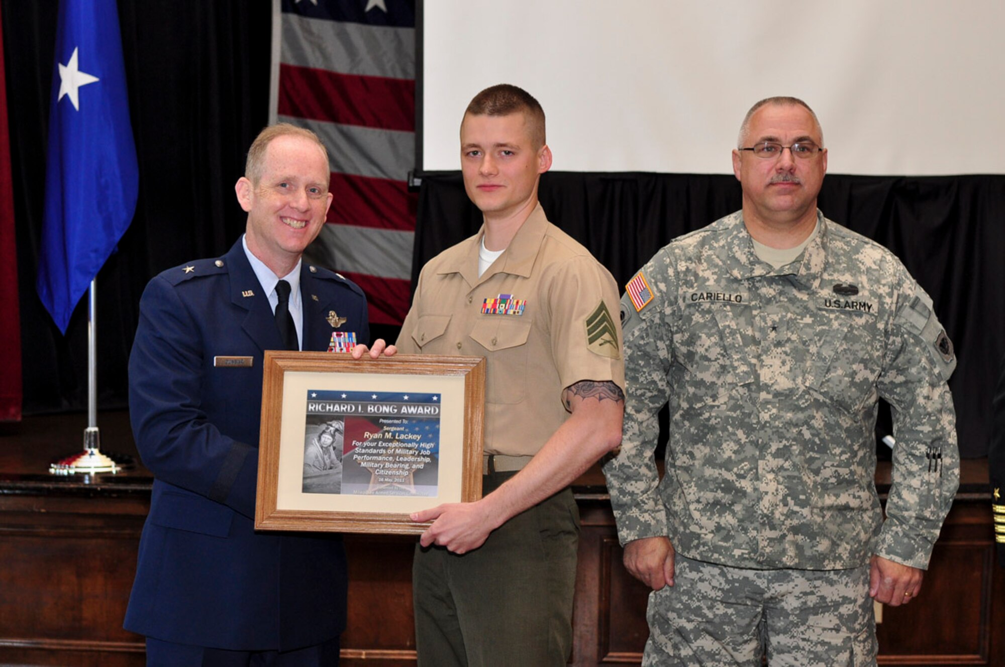 Sergeant Ryan M. Lackey of Fox Company, 2nd Battalion, 24th Marines receives the Bong Award during the ESGR breakfast held at the Wisconsin Club in downtown Milwaukee, May 16, 2011. Each year the Milwaukee Armed Forces Committee and Wisconsin Committee for Employer Support of the Guard and Reserve (ESGR) recognize the men and women who serve the armed forces and the employers that support them.  U.S. Air Force photo by Tech Sgt. Thomas J Sobczyk  / Released 