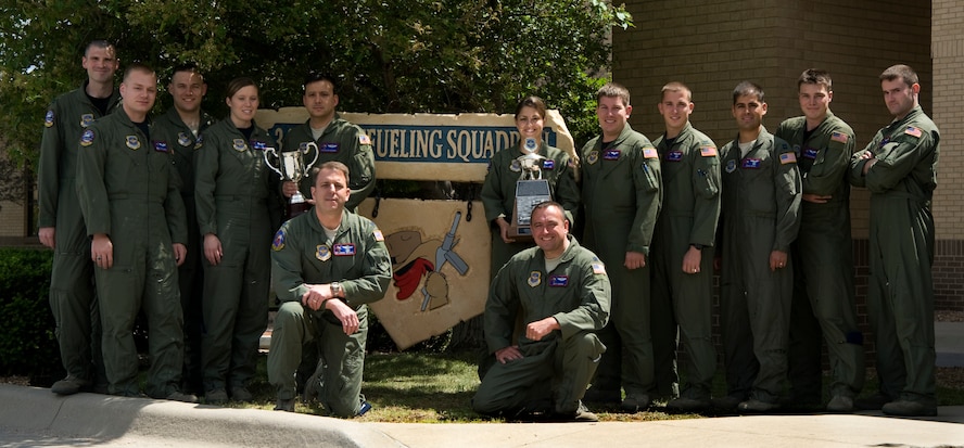 Members of the 349th Air Refueling Squadron pose for a photo with their 2008 and 2010 General Carl A. Spaatz Trophies, on May 5, 2011, at McConnell Air Force Base, Kan. The Spaatz Trophy recognizes the best of the best in air refueling unit in the Air Force. In 2008, the 349th ARS won the trophy. It was presented to them again for 2010. (U.S. Air Force Photo/Airman 1st Class Armando A. Schwier-Morales)