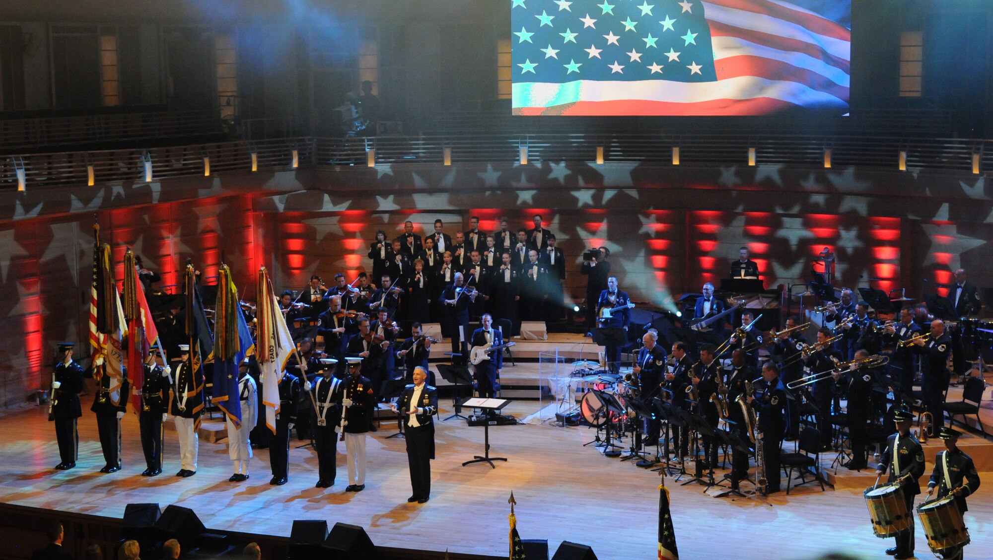 Members of the U.S. Armed Services joint color guard present the U.S. flag and service flags May 12 at the Music Center at Strathmore, Bethesda, Md. The performance was part of “America’s Veterans: A Musical Tribute,” which was taped for broadcast to be aired on Veterans Day. (U.S. Air Force photo by Senior Airman Christopher Ruano)