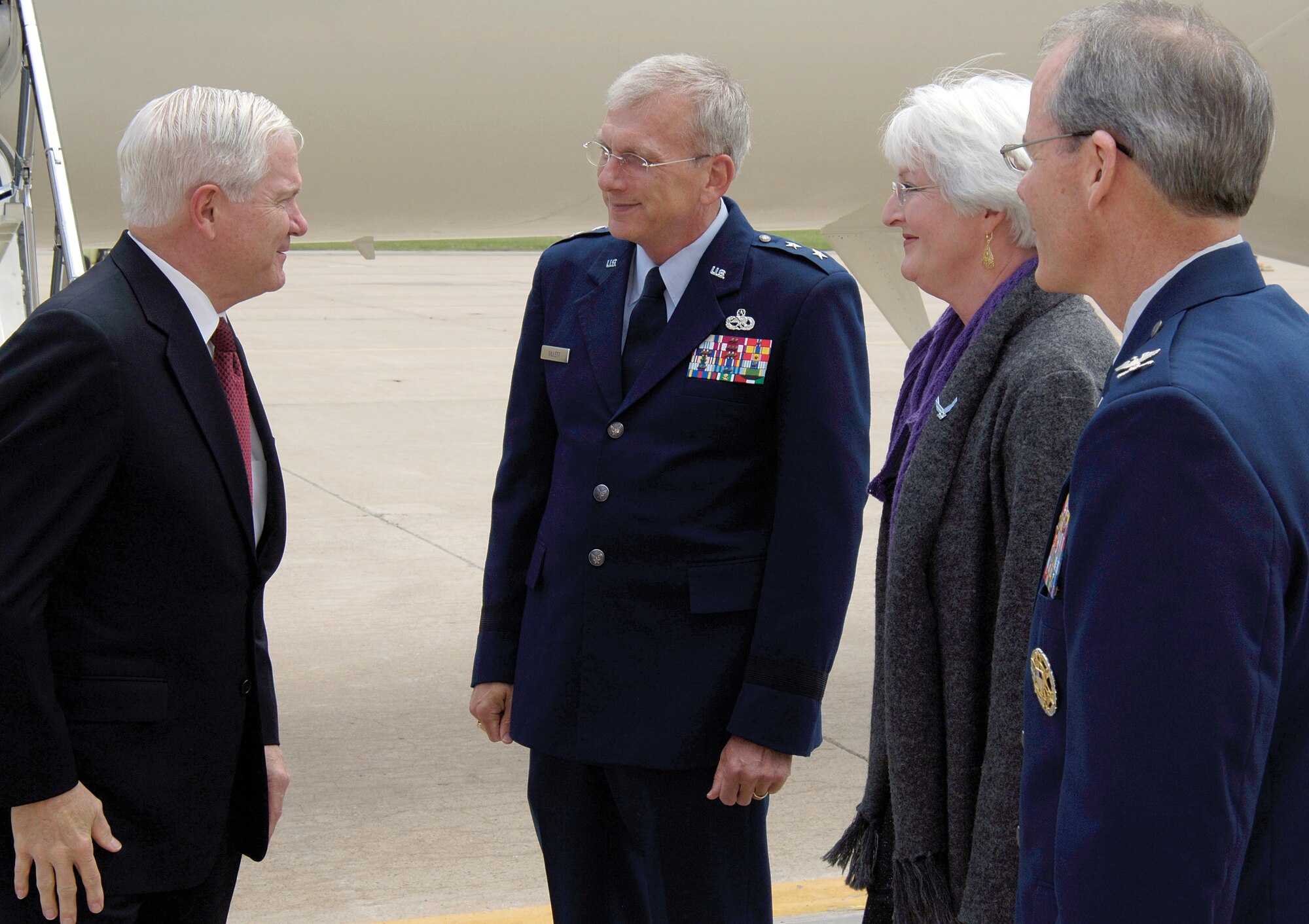 Upon his arrival to Tinker Air Force Base, Okla., May 13, Secretary of Defense, Robert Gates, is greeted by Maj. Gen. David Gillett, Oklahoma City Air Logistics Center commander, his wife Stacia, and Col. Robert LaBrutta, 72nd Air Base Wing and Tinker Installation commander. Secretary Gates was in Oklahoma to deliver the commencement speech for the University of Oklahoma graduation that evening.  (Air Force photo by Margo Wright)
