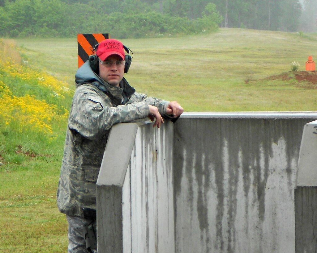 A 118th Airlift Wing Security Forces member prepares for the next shooter during a training exercise in Tullahoma May 15, 2011.