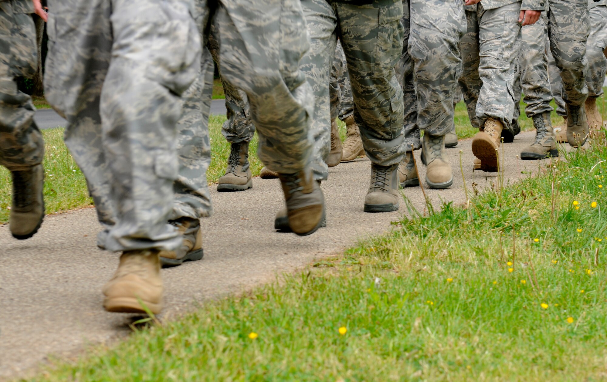 SPANGDAHLEM AIR BASE, Germany – 52nd Fighter Wing Airmen walk a six-mile ruck march here May 17. The ruck march was one of many events for National Police Week honoring fallen Air Force security forces members who have died in support of Operation Enduring Freedom and Operation Iraqi Freedom. Approximately 140 people participated in the ruck march. Approximately 140 people participated in the ruck march. (U.S. Air Force photo/Airman 1st Class Brittney Frees)