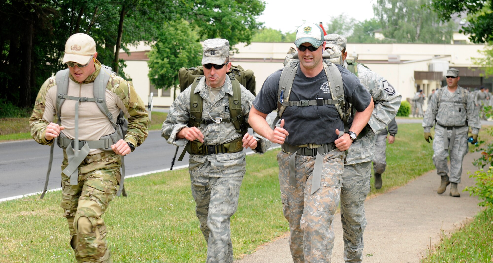 SPANGDAHLEM AIR BASE, Germany – 52nd Fighter Wing Airmen run during a six-mile ruck march here May 17. The ruck march was one of many events for National Police Week honoring fallen Air Force security forces members who have died in support of Operation Enduring Freedom and Operation Iraqi Freedom. Approximately 140 people participated in the ruck march. (U.S. Air Force photo/Airman 1st Class Brittney Frees)