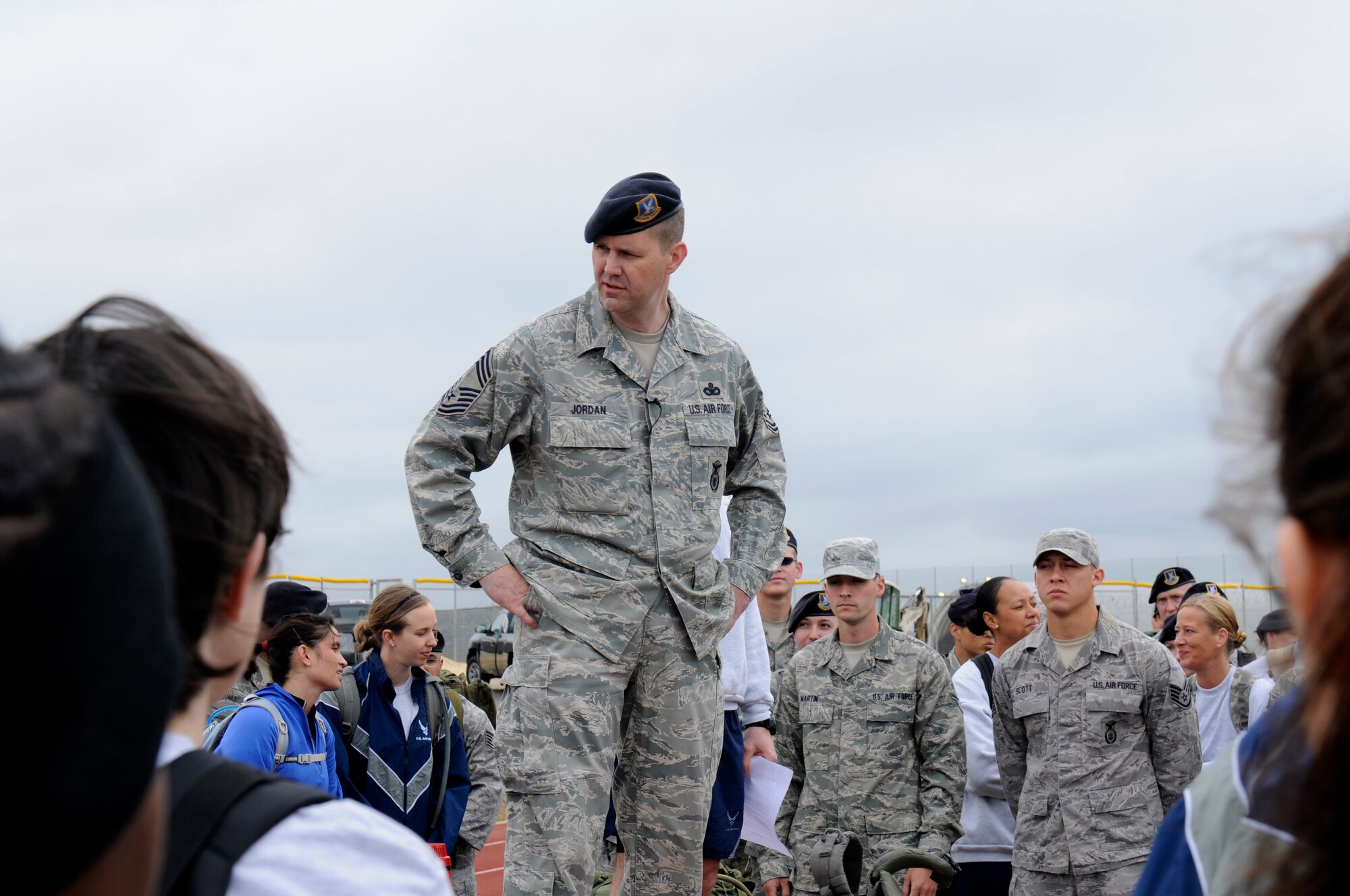 SPANGDAHLEM AIR BASE, Germany – Chief Master Sgt. Phillip Jordan, 52nd Security Forces Squadron security forces manager, speaks to 52nd Fighter Wing Airmen and family members before a ruck march that began at the Skelton Memorial Fitness Center here May 17. The ruck march was one of many events held for National Police Week honoring fallen Air Force security forces members who have died in support of Operation Enduring Freedom and Operation Iraqi Freedom. Approximately 140 people participated in the ruck march. (U.S. Air Force photo/Airman 1st Class Brittney Frees)
