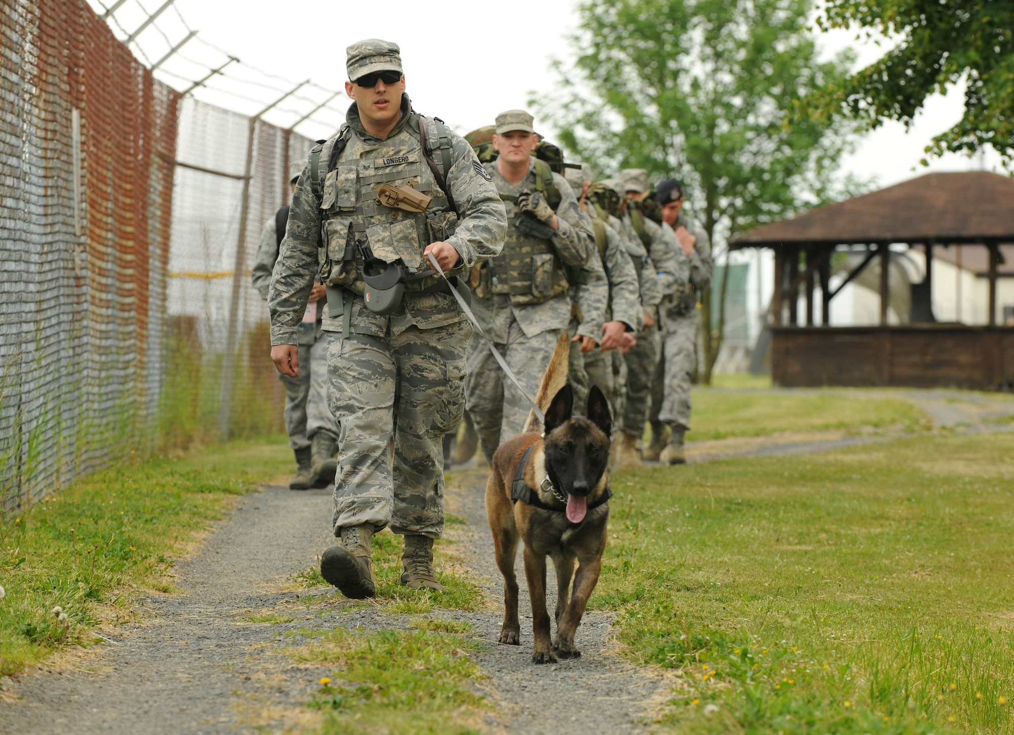 SPANGDAHLEM AIR BASE, Germany – Members of the 52nd Security Forces Squadron walk around the base during a ruck march as part of National Police Week here May 17. The ruck march was held in remembrance of Air Force security forces members who have died in support of Operation Iraqi Freedom and Operation Enduring Freedom. Approximately 140 active-duty service and family members participated in the ruck march. (U.S. Air Force photo/Senior Airman Nathanael Callon)
