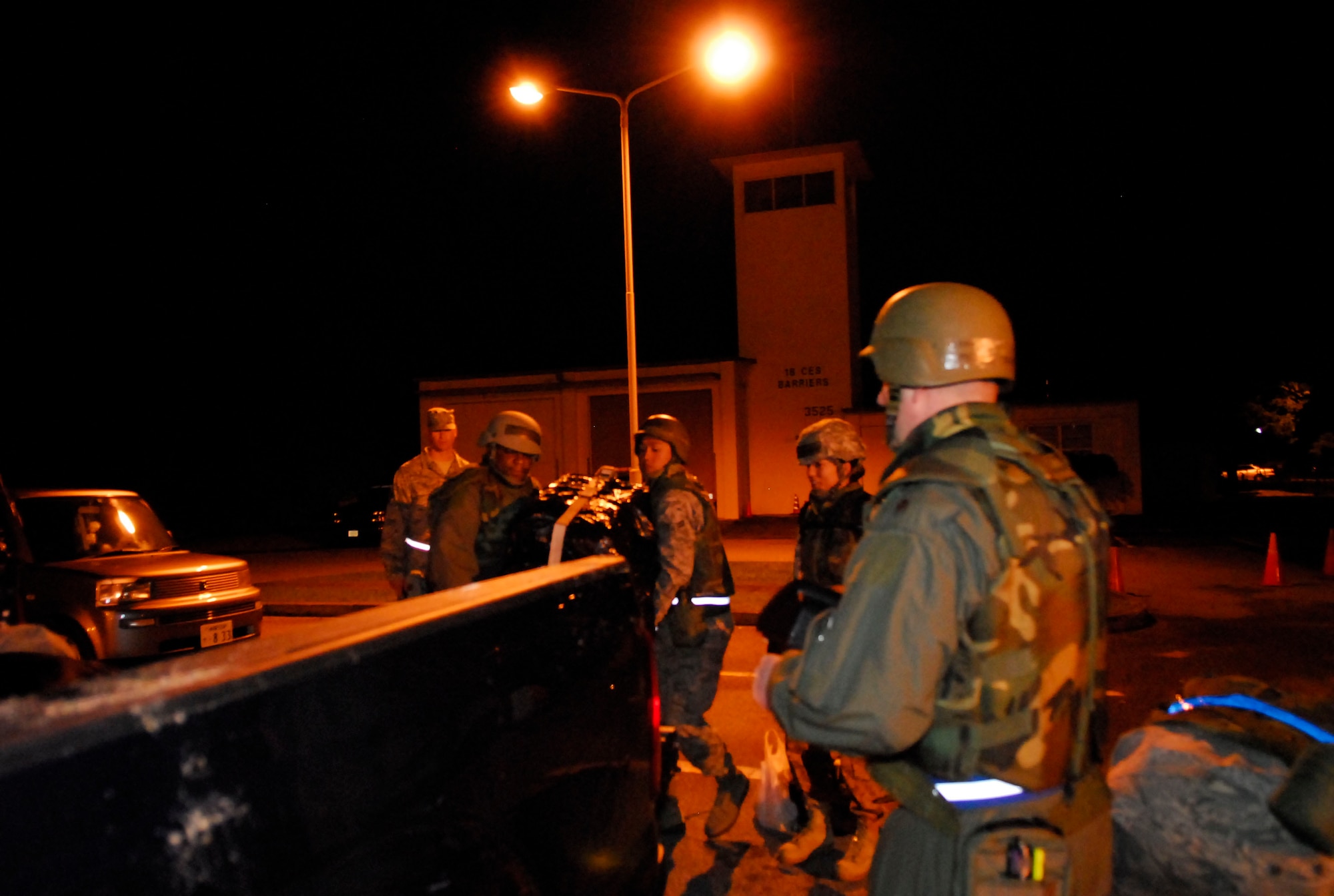 Airmen from the 961st Airborne Air Control Squadron participate in a Local Operations Readiness Exercise May 18 at Kadena Air Base, Japan. The Airmen loaded sensitive equipment onto a truck headed for their alternate operational location after a simulated power outage rendered their main building inoperative. The equipment was needed to re-establish a control center and continue operations. (Air Force photo/ Airman 1st Class Lottie J. Lowrey)

