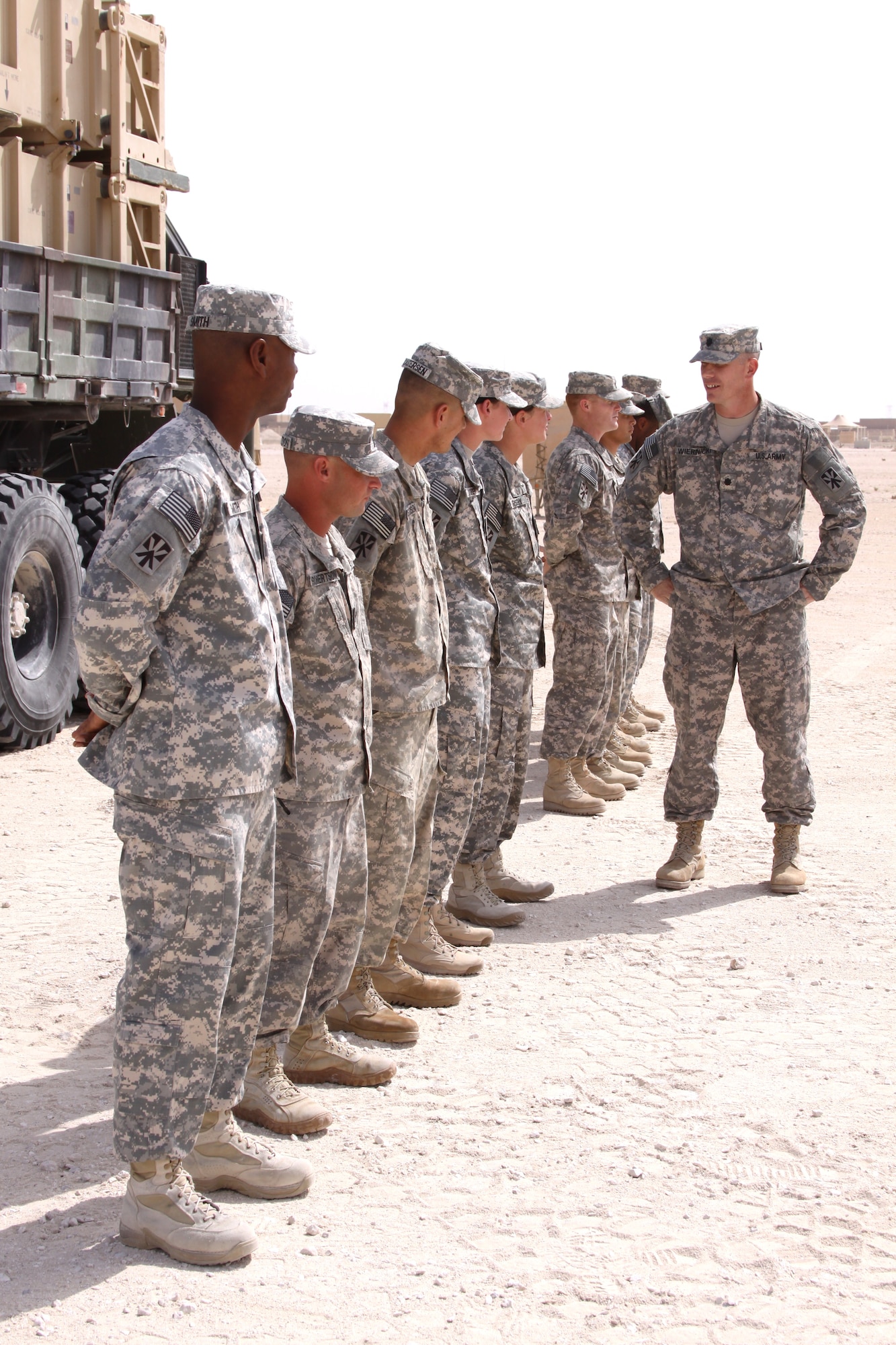 U.S. Army Lt. Col. Alan Wiernicki, the 2-43 Air Defense Artillery Battalion commander, congratulates the Bravo and Charlie Battery launcher reload crews at an award ceremony April 29 in Southwest Asia. (U.S. Army photo/Sgt. Daniel Aguilar)