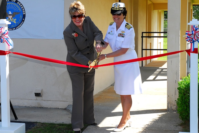Carolyn Adams and Capt. Paula McClure cut the ribbon for the grand opening of the Joint Veteran's Administration Optometry clinic at Joint Base Charleston-Weapons Station, May 17. The facility is Charleston's first joint initiative between the Department of Veterans Affairs and the Department of Defense. The clinic offers optometry and audiology services for veterans, DoD dependents and retirees and will be staffed by five full-time  employees. Ms. Adams is the  Ralph H.Johnson Veteran Affairs Medical Center director and Captain McClure is the Naval Health Clinic Charleston commander. (U.S. Navy photo/ Machinist’s Mate 3rd Class Brannon Deugan)