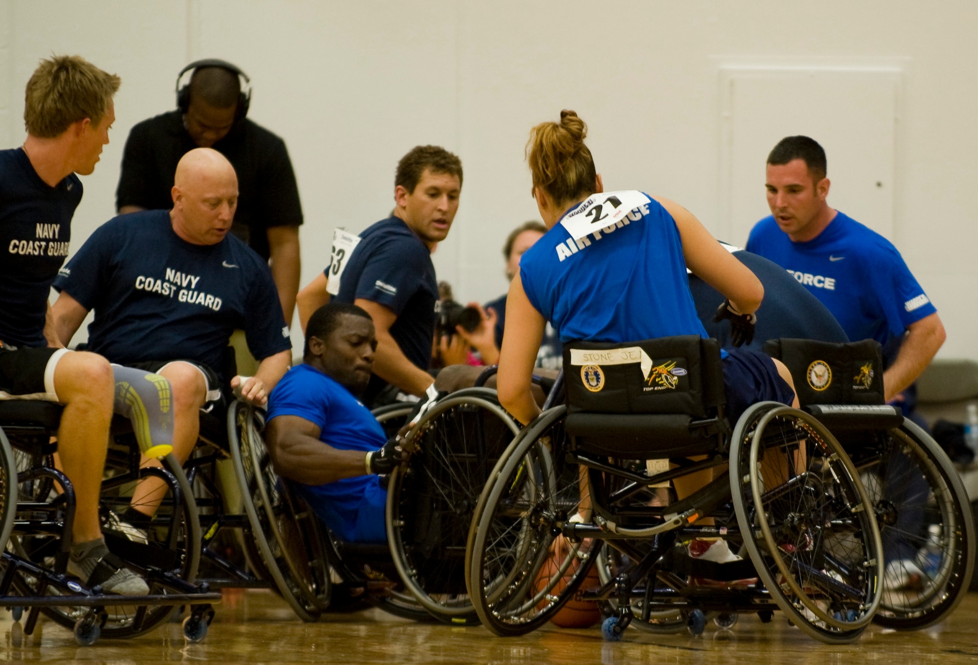 The Air Force wheelchair basketball team battles the Navy team for possession of the ball May 17, 2011, during the 2011 Warrior Games in Colorado Springs, Colo. The Navy beat the Air Force 23-14 and next will face the Marine Corps.  The Air Force team will play the Army. (U.S. Air Force photo/Staff Sgt. Christopher Griffin)