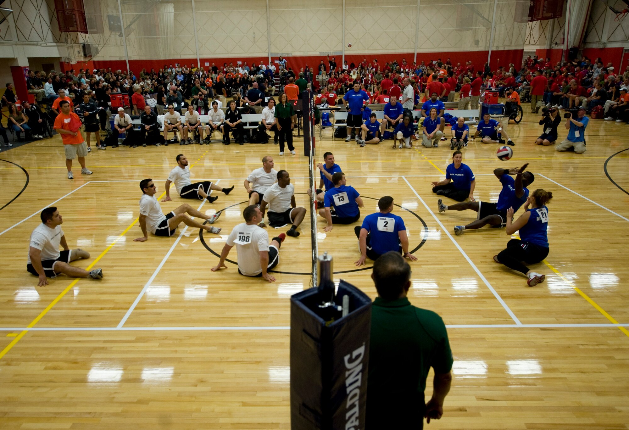 The Air Force and United States Special Operations Command battle during sitting volleyball competition at the 2011 Warrior Games in Colorado Springs, Colo., May 17. SOCOM won the series 2 games to 1. (U.S. Air Force photo/Staff Sgt. Christopher Griffin)