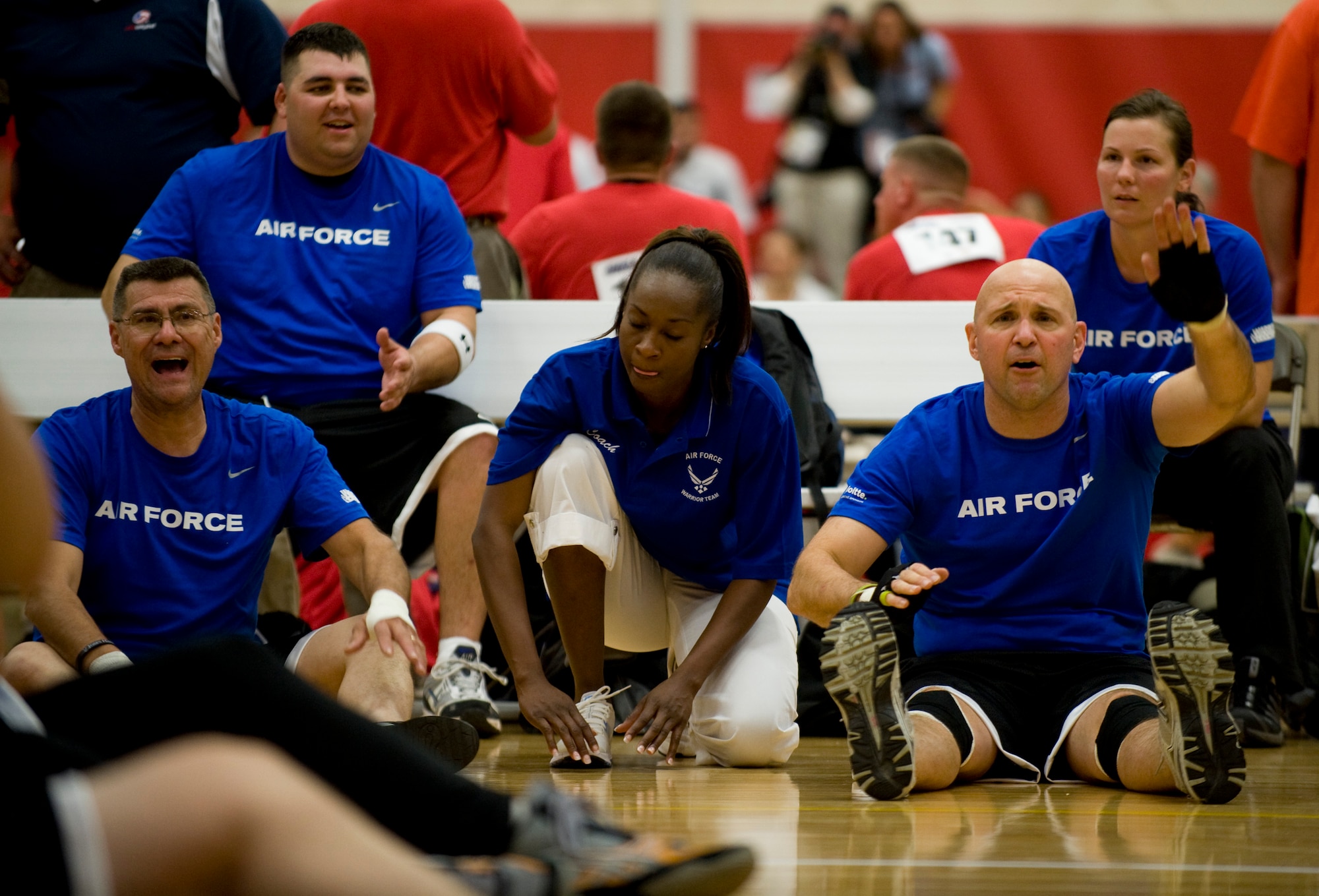 The Air Force sideline cheers on their team during sitting volleyball at the 2011 Warrior Games in Colorado Springs, Colo., May 17. The Air Force played the U.S. Special Operations Command team, losing the series 2 games to 1. (U.S. Air Force photo/Staff Sgt. Christopher Griffin)