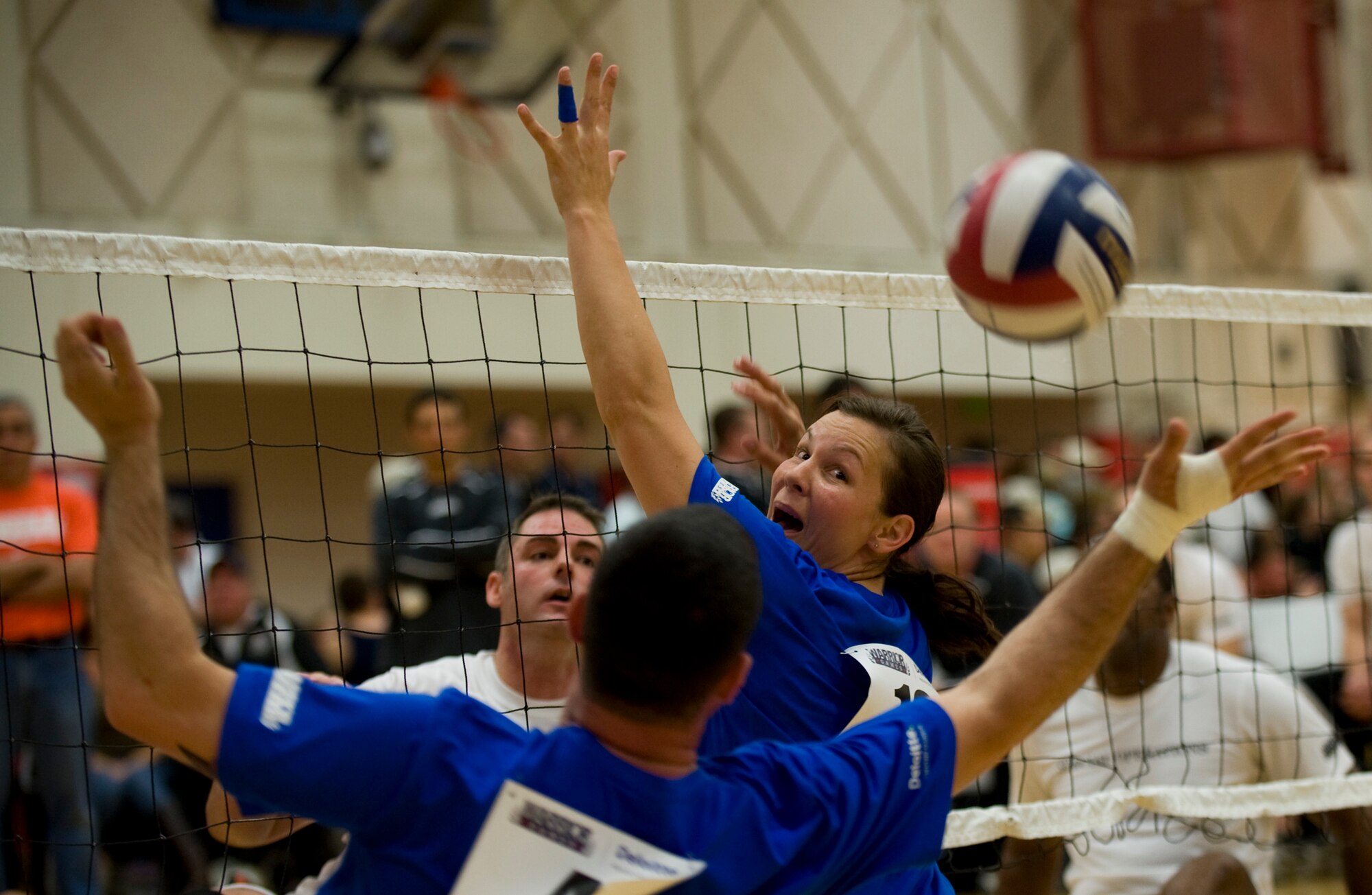 Retired Staff Sgt. Stacy Pearsall looks back as volleyball slips past and is saved by Staff Sgt. Christopher D?Angelo during the 2011 Warrior Games in Colorado Springs, Colo., May 17. The Air Force played the U.S. Special Operations Command team, losing the series 2 games to 1. (U.S. Air Force photo/Staff Sgt. Christopher Griffin)