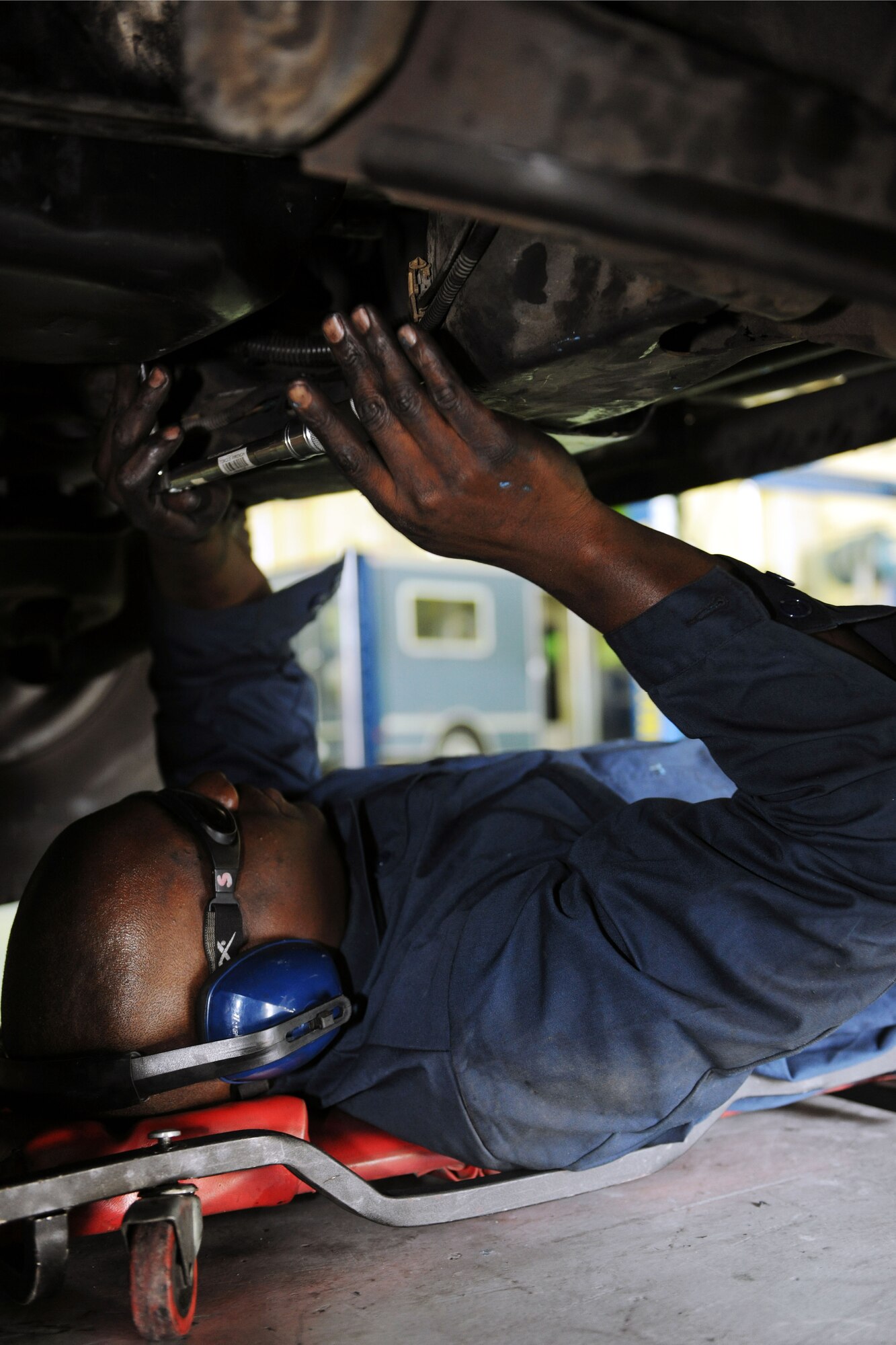 KUNSAN AIR BASE, Republic of Korea -- Airman 1st Class Brian Johnson, 8th Logistics Readiness Squadron vehicle maintenance journeyman, torques an oil pin to specification on a multi-stop van. The 8th LRS has a fleet of approximately 360 vehicles worth more than $30 million. (U.S. Air Force photo/Senior Airman Brittany Y. Bateman)