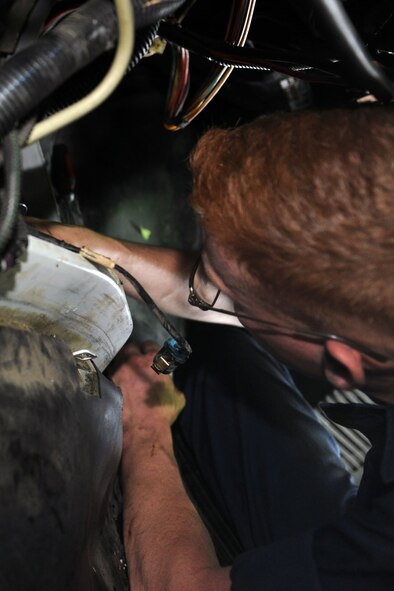 KUNSAN AIR BASE, Republic of Korea -- Airman 1st Class Stewart Brown, 8th Logistics Readiness Squadron vehicle maintenance journeyman, changes the head gasket on a multi-stop van here May 17. The 8th LRS has a fleet of approximately 360 vehicles worth more than $30 million. (U.S. Air Force photo/Senior Airman Brittany Y. Bateman)