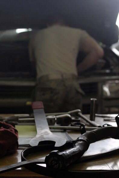 KUNSAN AIR BASE, Republic of Korea -- Airman 1st Class Stewart Brown, 8th Logistics Readiness Squadron vehicle maintenance journeyman, takes the steering pump out of a multi-stop van here May 17. The 8th LRS maintenance flight repairs and maintains various types of vehicles to ensure the Wolf Pack stays mobile. (U.S. Air Force photo/Senior Airman Brittany Y. Bateman)