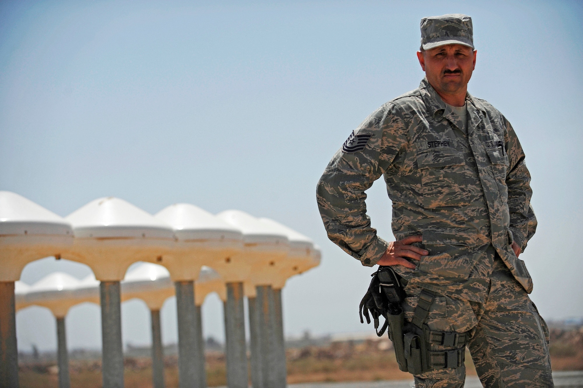 CAMP TAJI, Iraq -- Tech. Sgt. RK Stephey, communications advisor for the base transition team here, stands beside a Doppler VHF Omni-directional Radio system he and experts from Hanscom Air Force Base, Mass., installed for the Iraqi Army Aviation Command. Sergeant Stephey redeployed back to Misawa Air Base, Japan, after six months of helping his Iraqi partners set up their first defense networking system and initiating various communications programs. Sergeant Stephey calls Prescott, Ariz., home. (U.S. Air Force/Tech. Sgt. Jason Lake)
