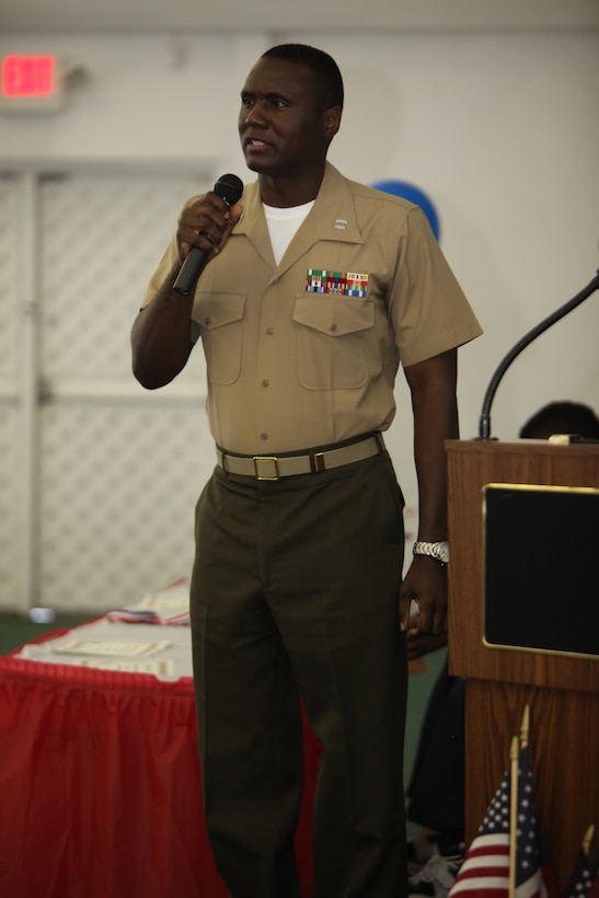Capt. Deon Sanders, the G-1 operations officer for Marine Forces Reserve, speaks to teachers and students at the West Bank Community School May 18.  Sanders has coordinated the volunteer efforts of Marines at the school since October 2010.