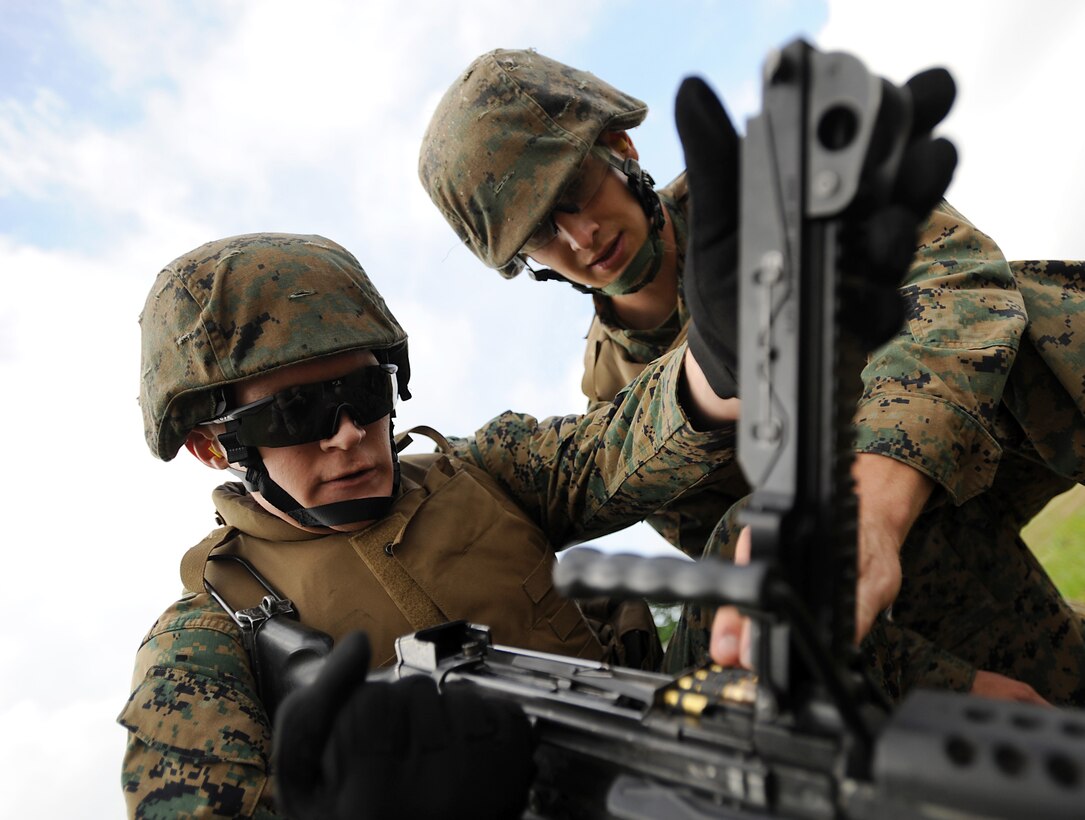 Lance Cpl. Jesse Ballard performs remedial action on the M-249 Squad Automatic Weapon at Marine Corps Bases Quantico, Va., May 18. Ballard is an administrative clerk with Headquarters and Service Company, Marine Barracks Washington.