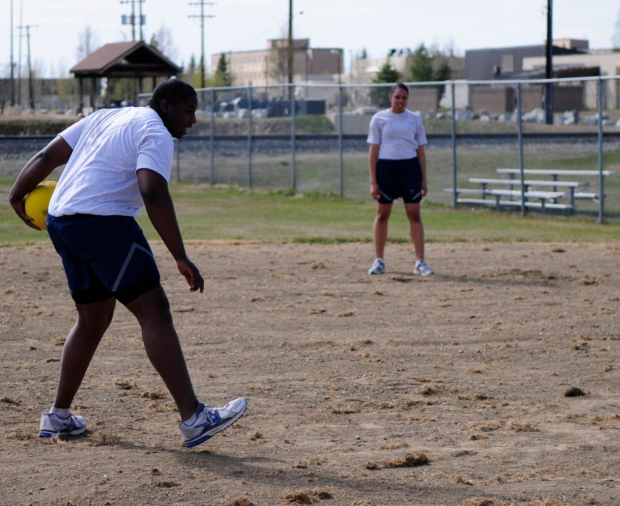 Airman 1st Class Stanley Harper winds up for the pitch during a game of kickball May 17, 2011, Eielson Air Force Base, Alaska.  Today's Airmen choose to put fitness first by participating in all types of physical activities and training.  Airman Harper is a customer service technician assigned to the 354th Comptroller Squadron.  (U.S. Air Force photo/Airman 1st Class Yash Rojas)
