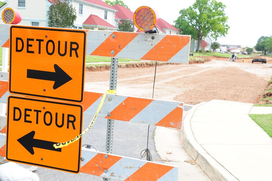A detour barrier alerts motorists to a construction zone on Rickenbacker Avenue near the Barksdale Fitness Center on Barksdale Air Force Base, La., May 19. Construction crews are adding drainage structures, which prevent high-water build-up and improves vehicle safety. The two-phase construction project will continue until approximately Aug. 12, however the fitness center’s overflow parking lot is slated to reopen July 11. (U.S. Air Force photo/Senior Airman Joanna M. Kresge)