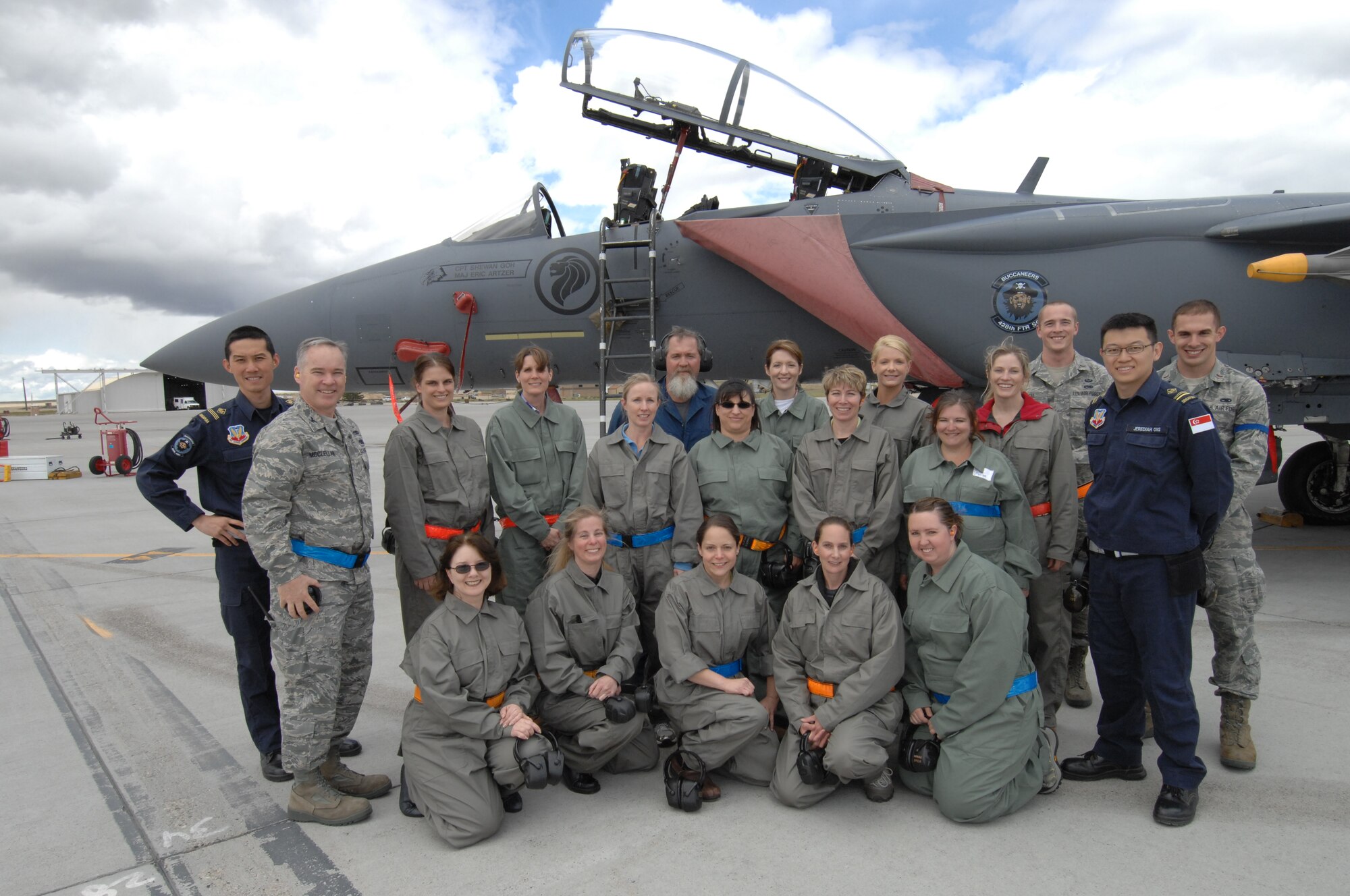 MOUNTAIN HOME AIR FORCE BASE, Idaho – Participants of the 366th Maintenance Group’s wing senior leadership spouses day pose with 366th MXG members, Republic of Singapore Air Force maintainers, as well as Col. James McClellan, in front of a RSAF F-15SG aircraft here May 16. The spouses were given a tour of the MXG facilities and a rare opportunity to walk the flightline during aircraft launches.  (U.S. Air Force photo by Senior Airman Benjamin Sutton)
